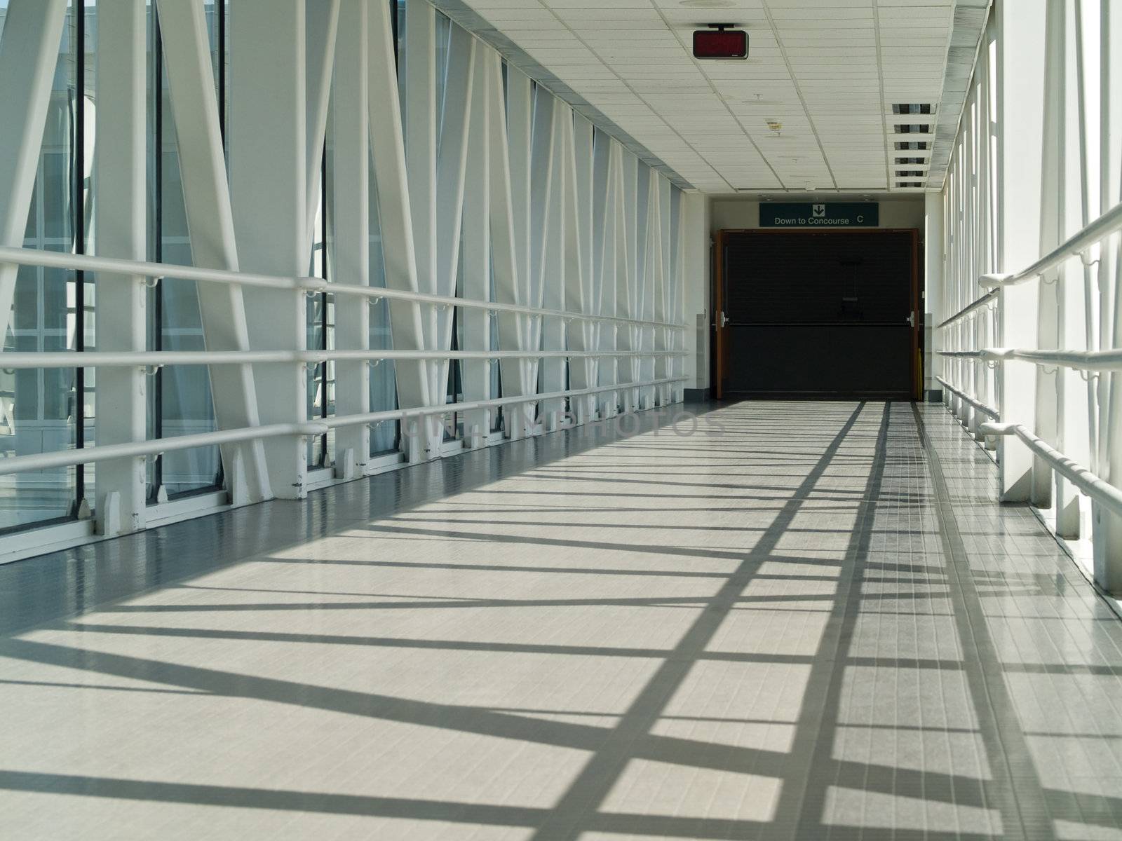 Covered Skywalk Tunnel with the Sun Shining by Frankljunior