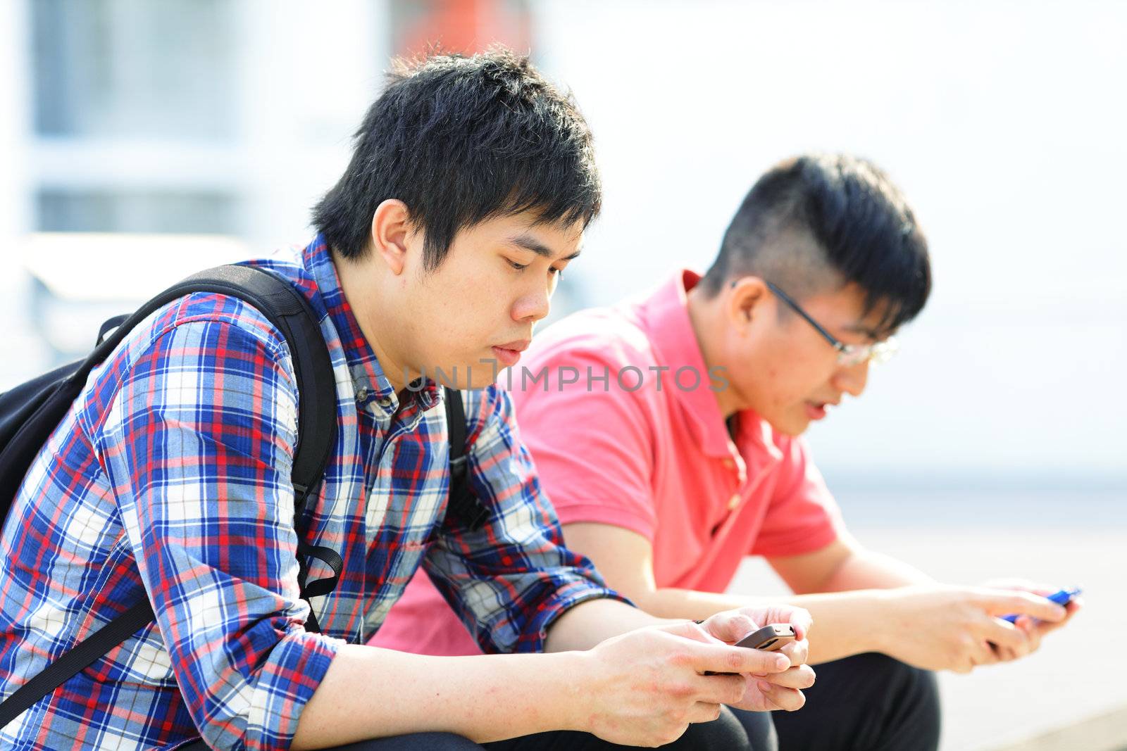 friend using phone by leungchopan