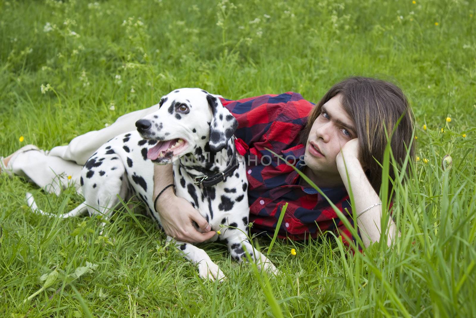 boy and the dalmatian dog on the grass by miradrozdowski