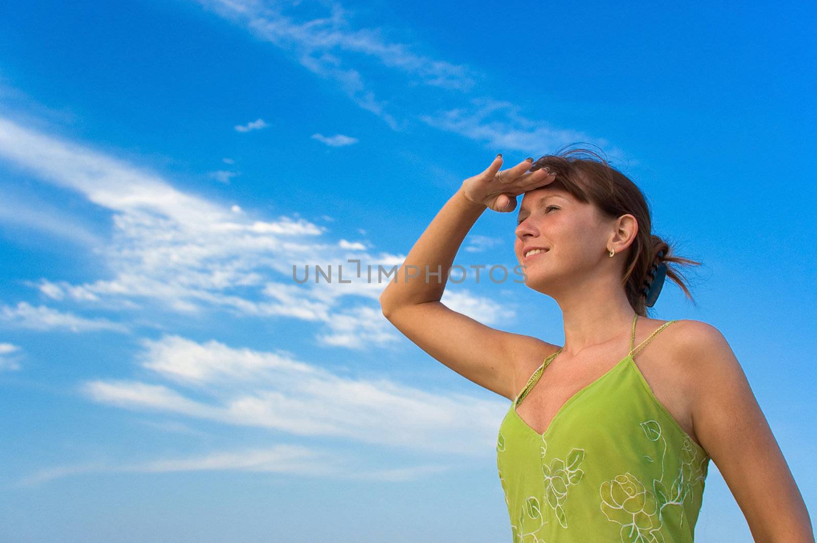 happy carefree girl looks away over the horizon