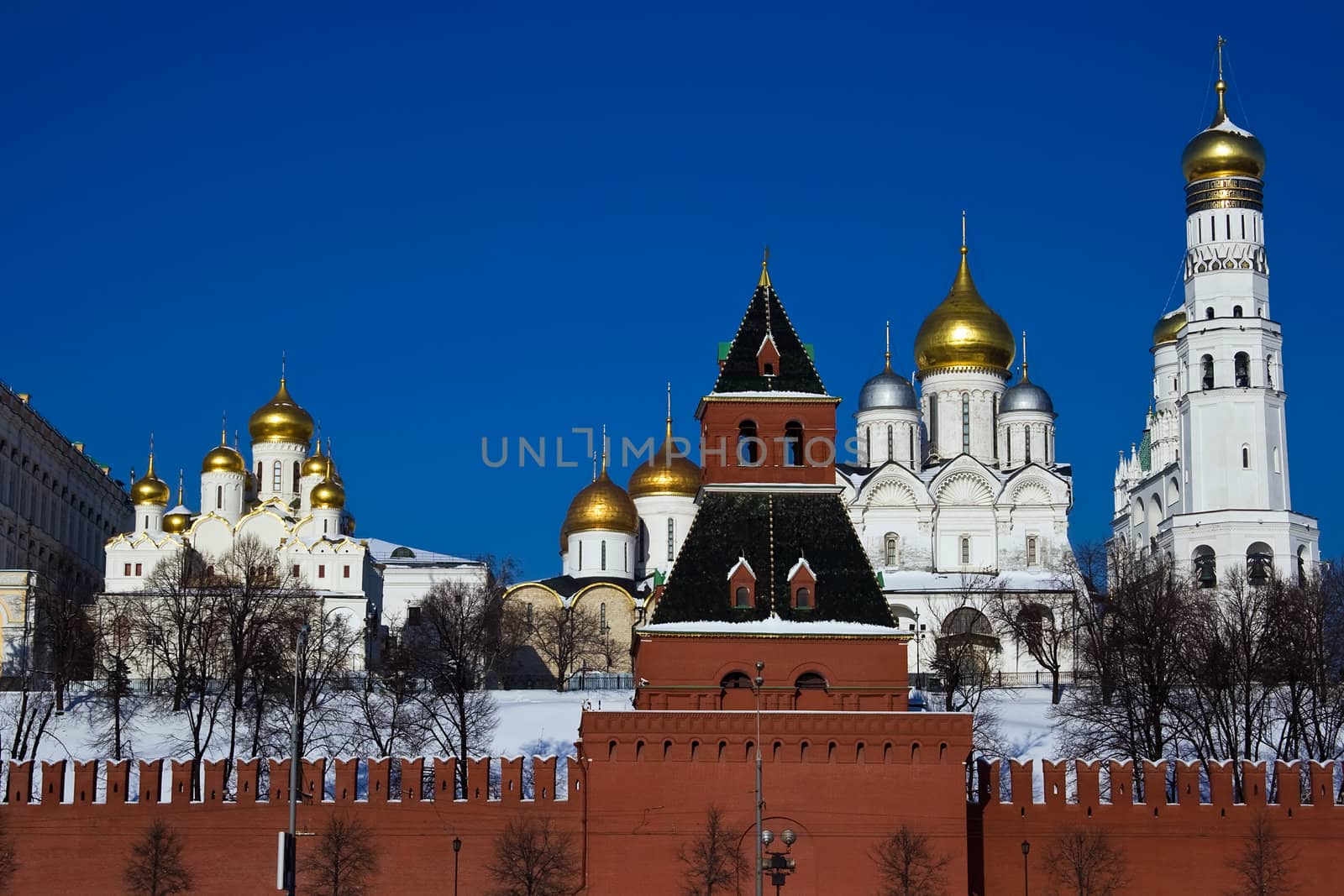 Red brick walls of famous Kremlin in Moscow with its churches