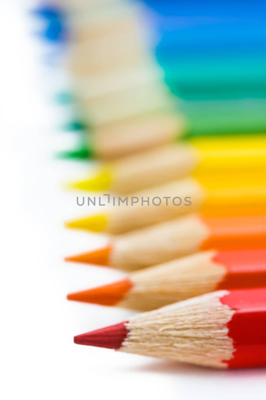 coloured pencils with shadow on white background