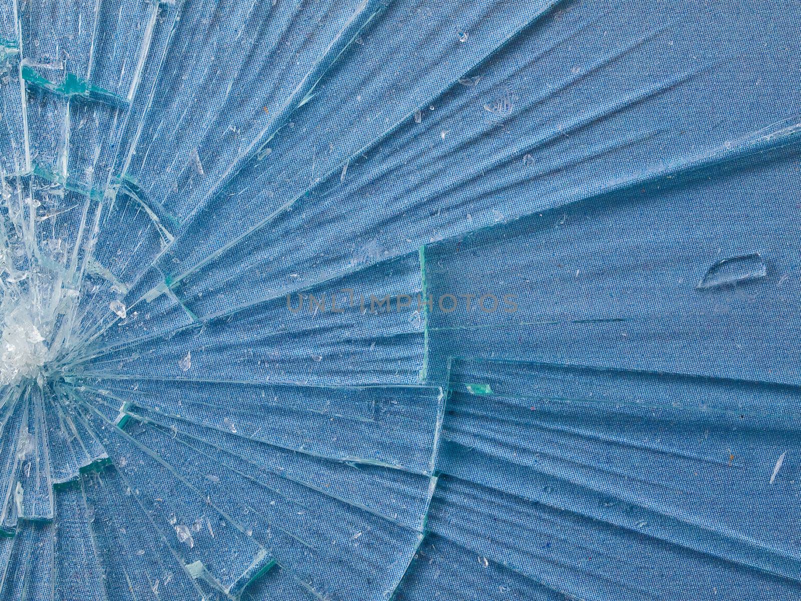 Cracked Glass Macro with a Sky Blue Patterned Background