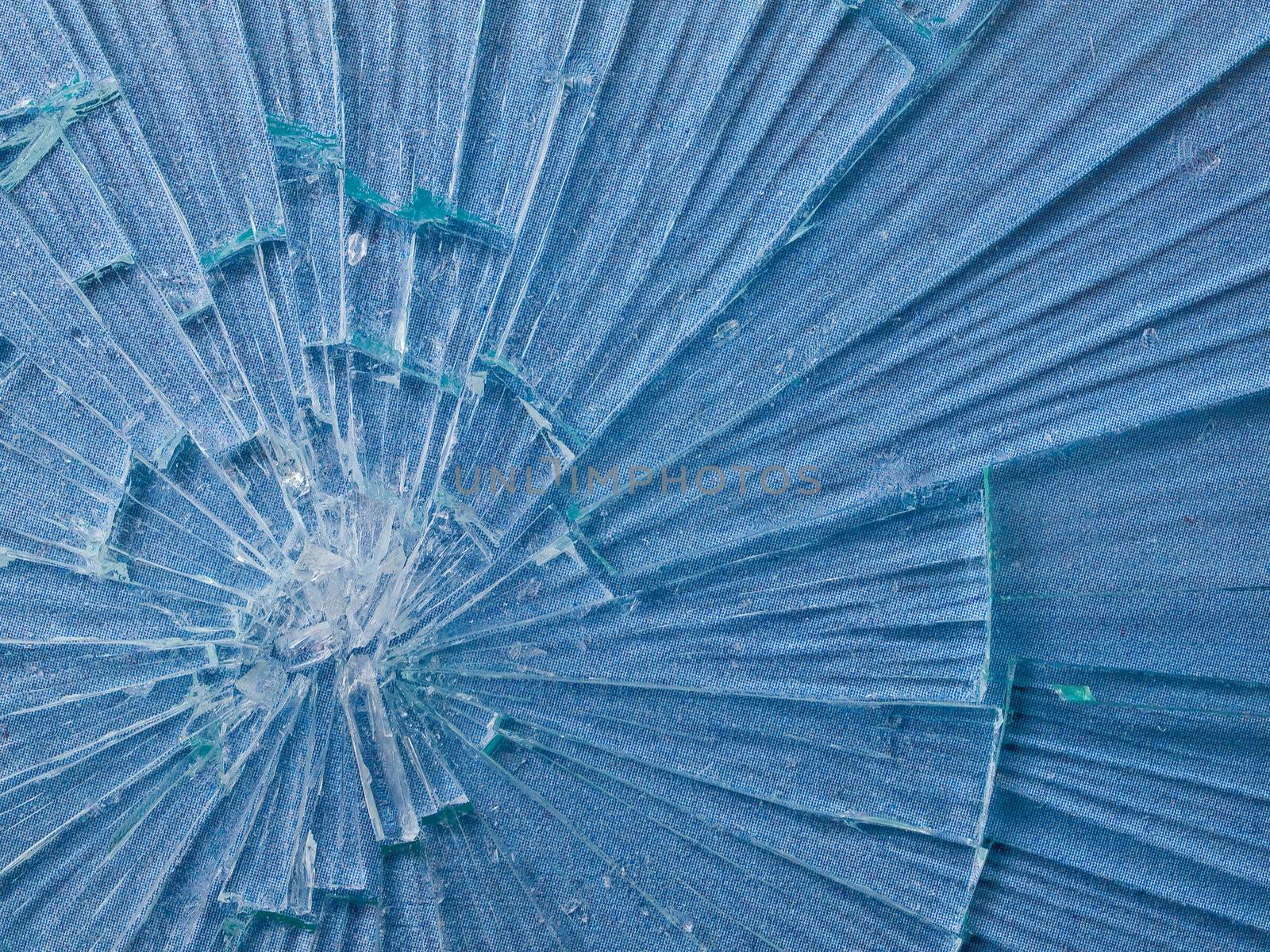 Cracked Glass Macro with a Sky Blue Patterned Background by Frankljunior