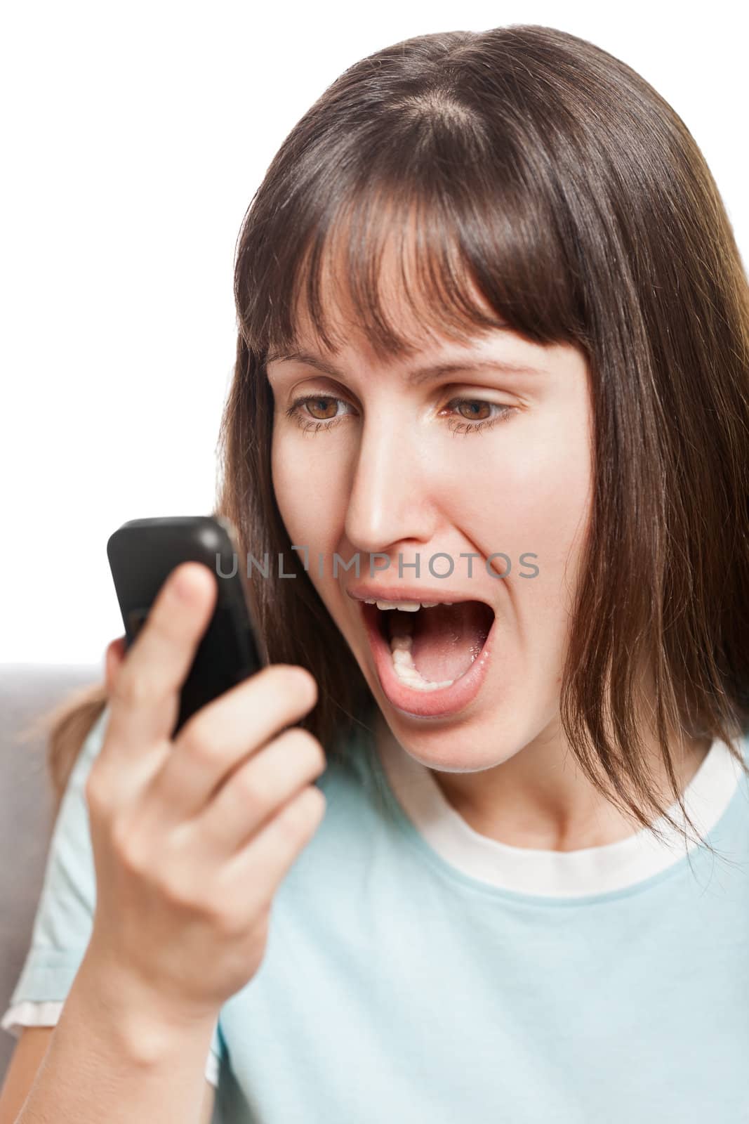 Angry woman talking mobile phone by ia_64