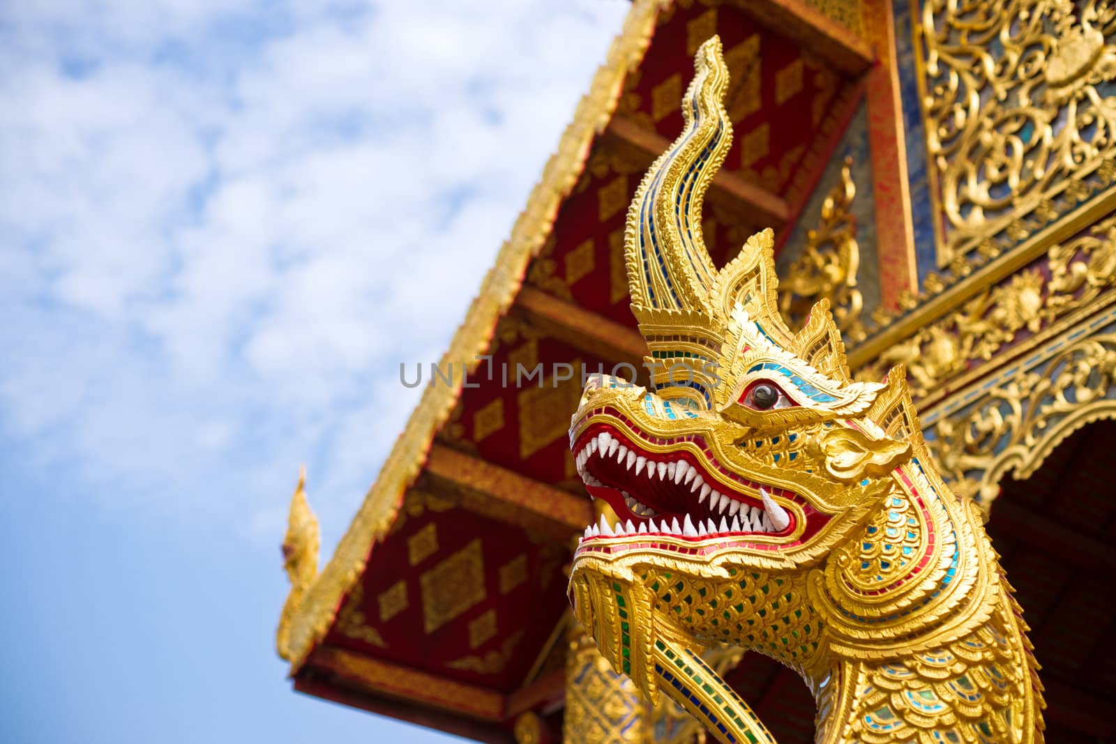 Statue of golden dragon in asian temple
