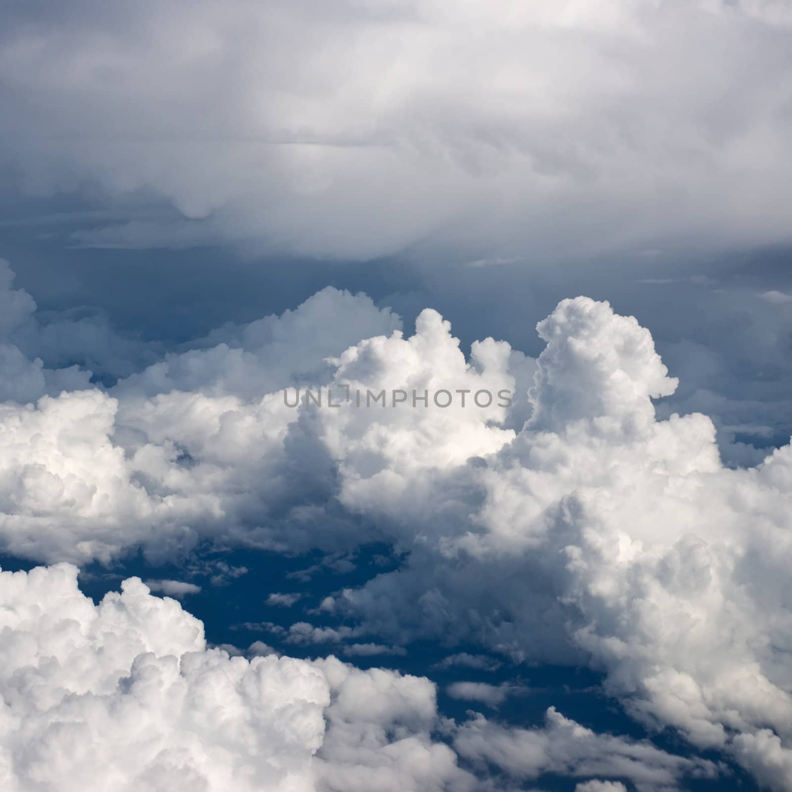 Aerial view on white fluffy clouds