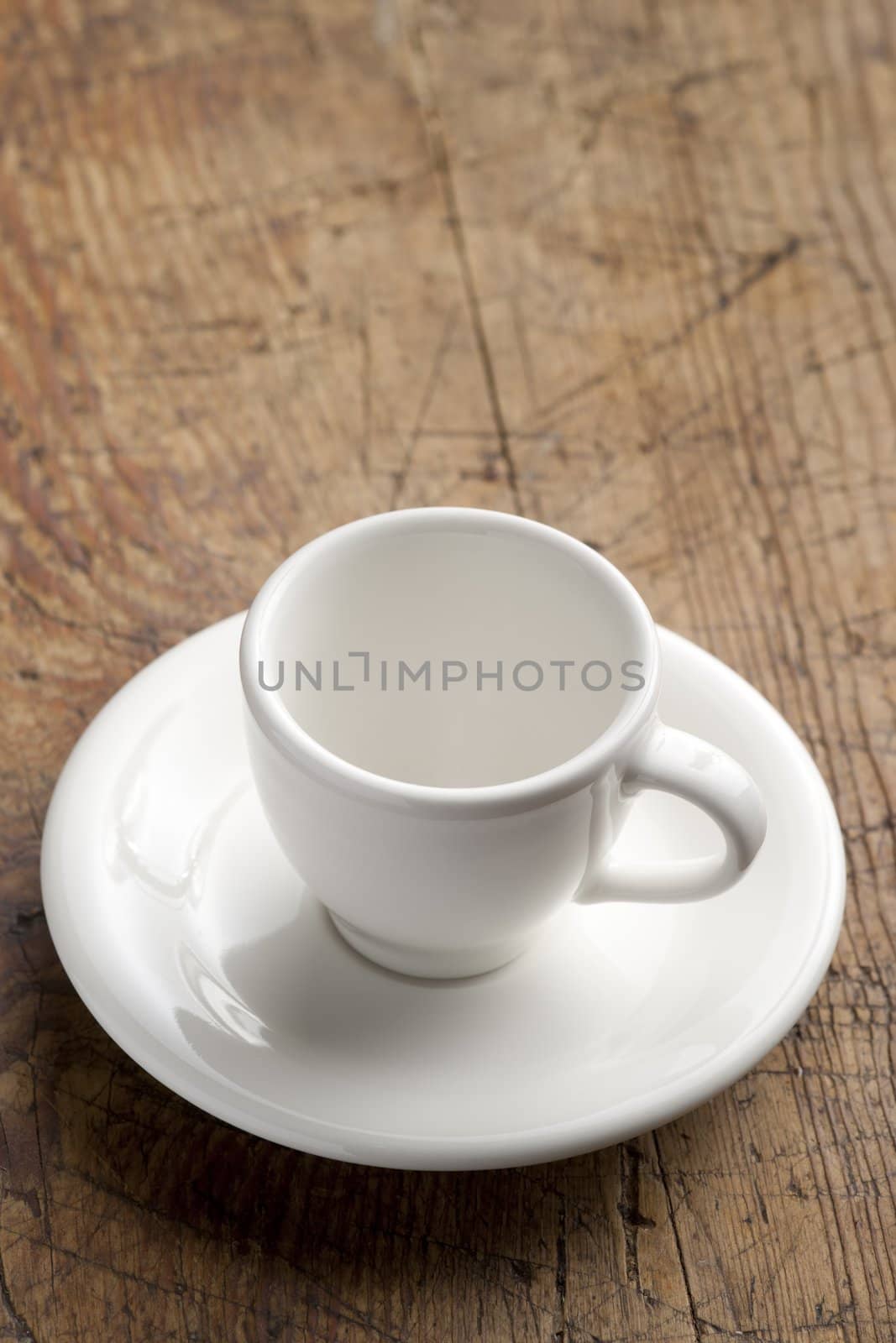 Empty white china coffee cup on the table.