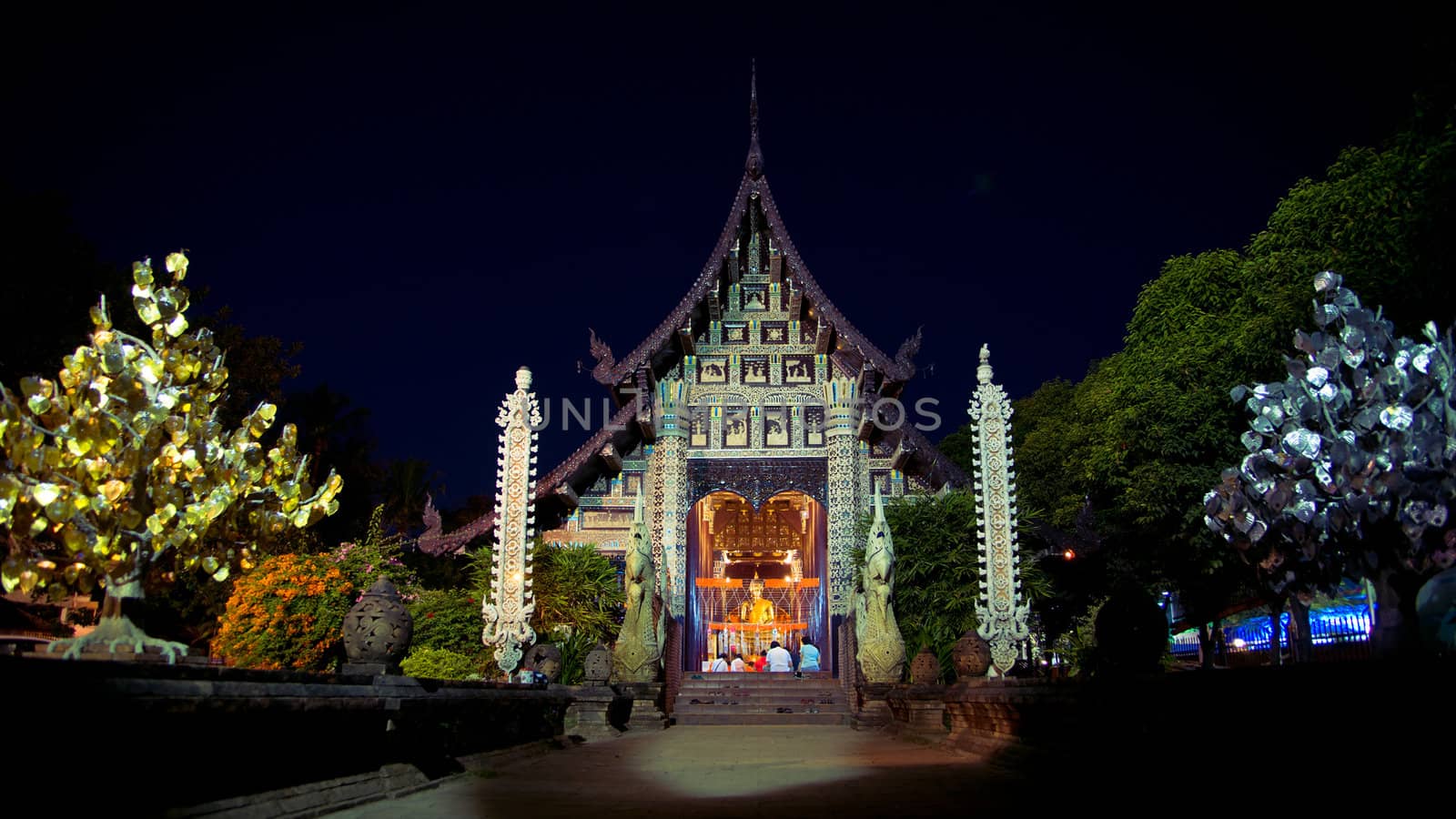 Night prayer at Lok Molee temple in Chiangmai, Thailand
