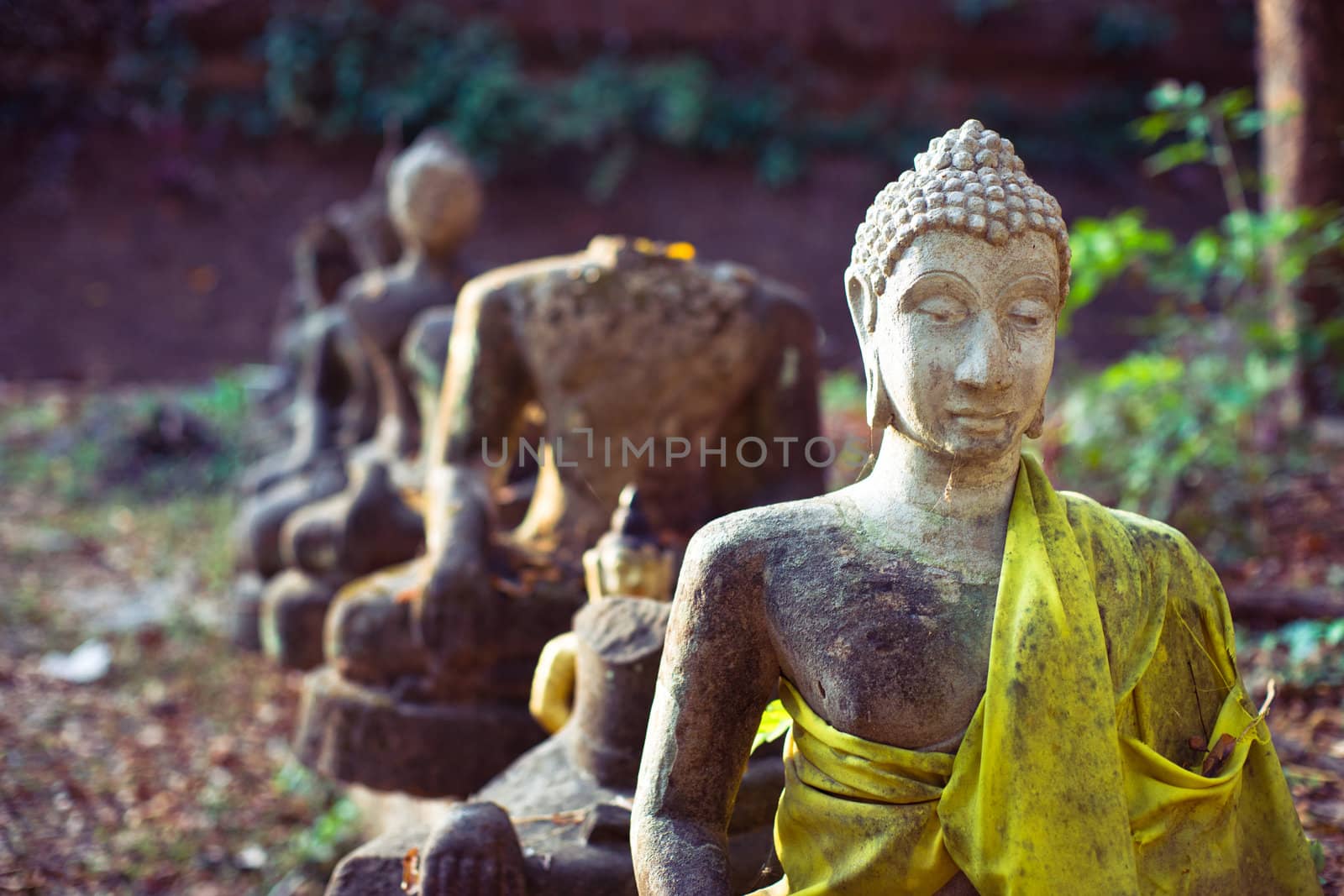 Old ruined buddhist statues in the ancient temple in Chiangmai, Thailand