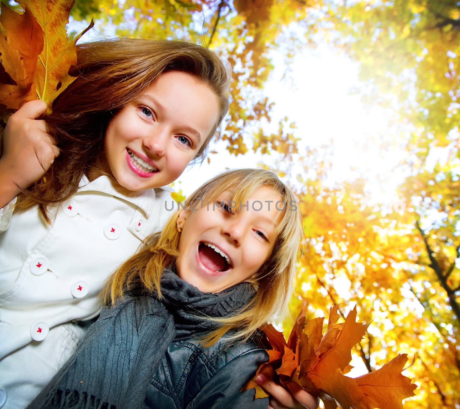 Beautiful Teenage Girls Having Fun in Autumn Park .Outdoor by SubbotinaA