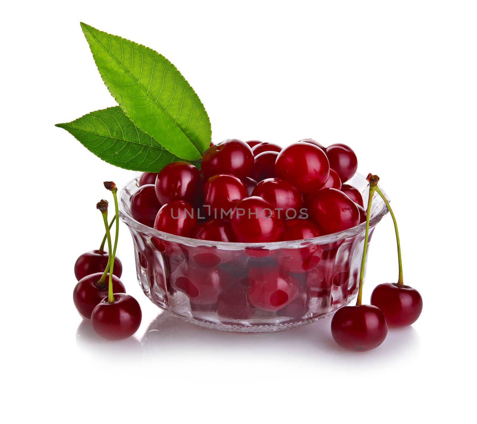 fresh cherry berries with green leaf isolated on white background 