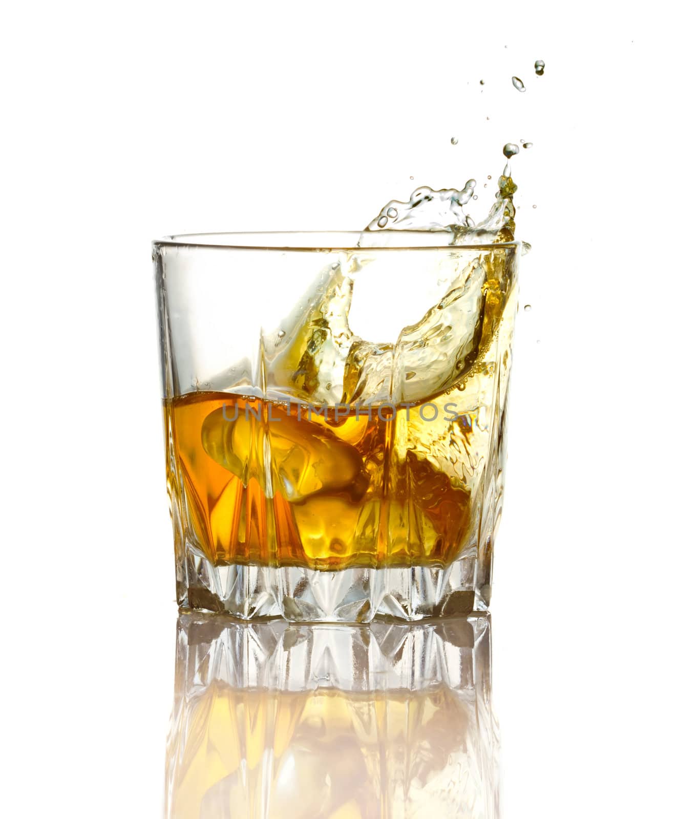 Splash in glass of whiskey and ice isolated by alphacell