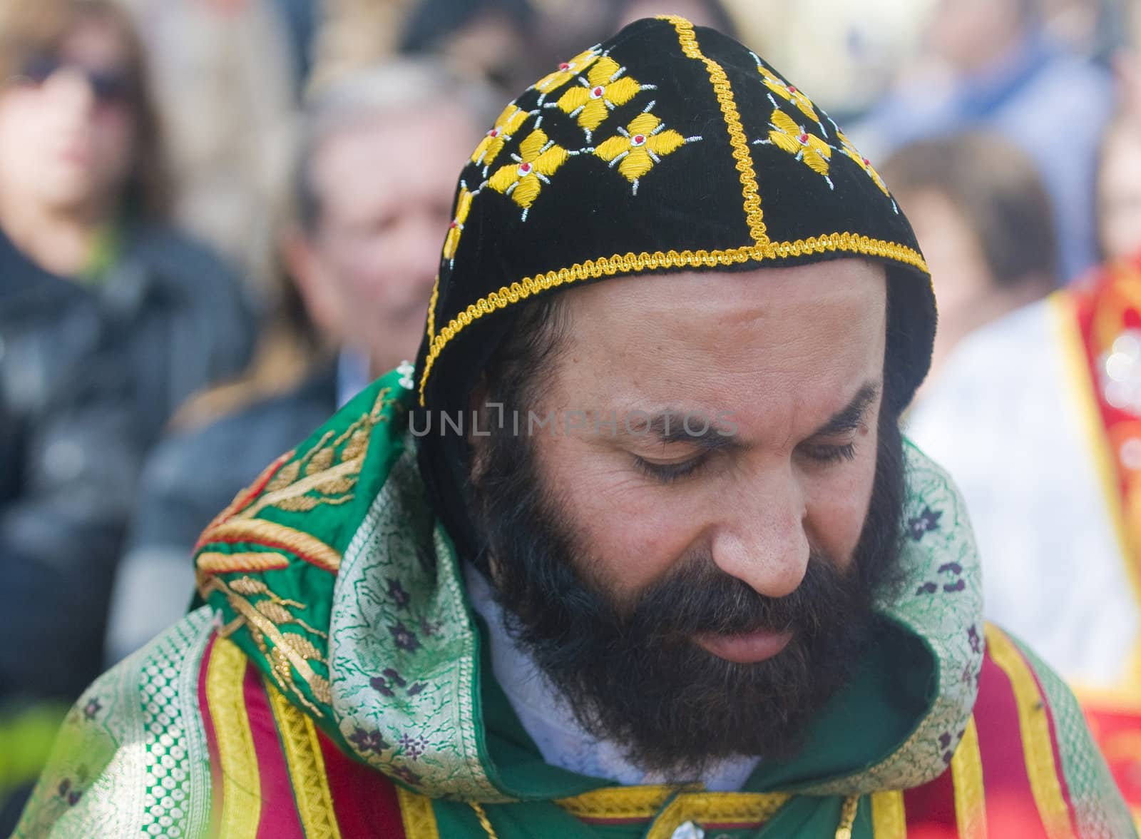 QASER EL YAHUD , ISRAEL - JAN 19 : Syrian Orthodox priest participates in the annual baptising ceremony during the epiphany at Qaser el yahud , Israel in January 19 2012