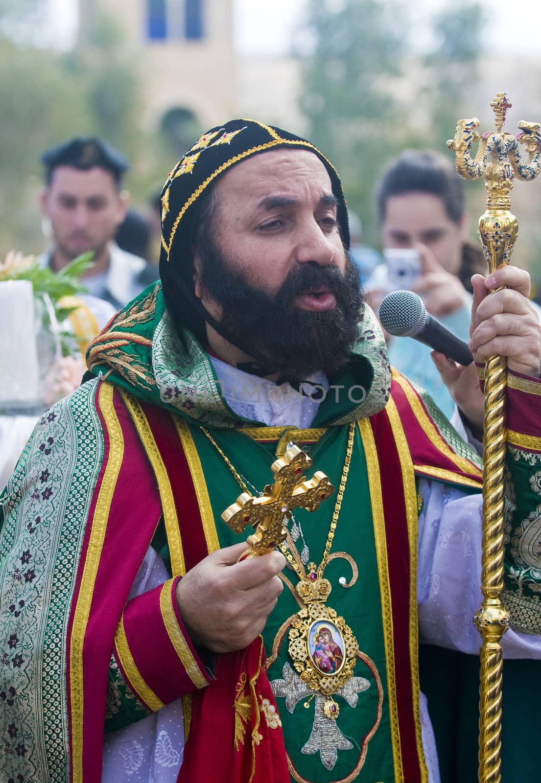 QASER EL YAHUD , ISRAEL - JAN 19 : Syrian Orthodox priest participates in the annual baptising ceremony during the epiphany at Qaser el yahud , Israel in January 19 2012