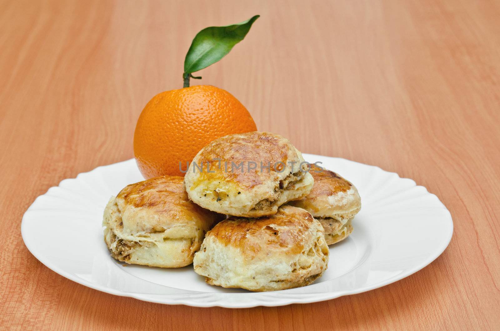 Pork Rind biscuits and orange on the plate, Shallow DOF