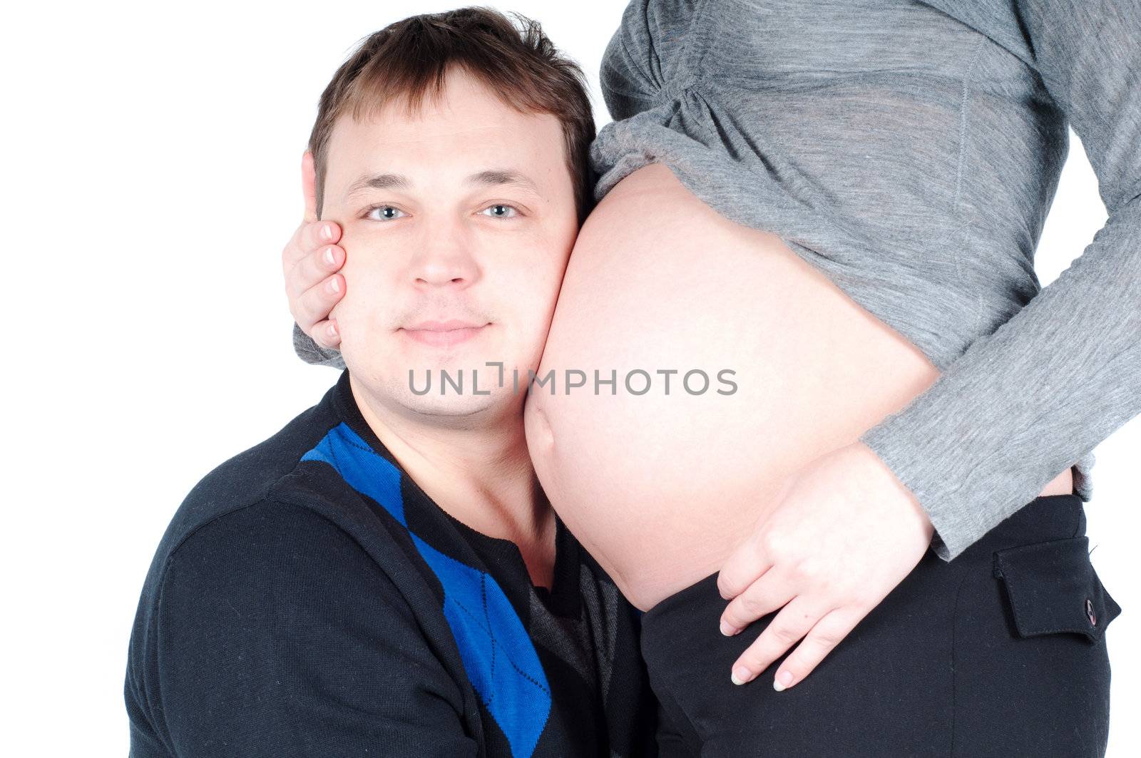 Shot of pregnant woman and her husband isolated on white