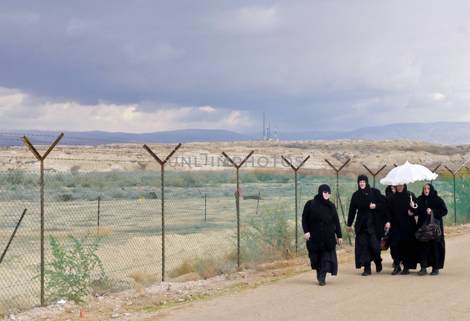 QASER EL YAHUD , ISRAEL - JAN 18 : Unidentified nuns participates in the baptising ritual during the epiphany at Qaser el yahud , Israel in January 18 2012