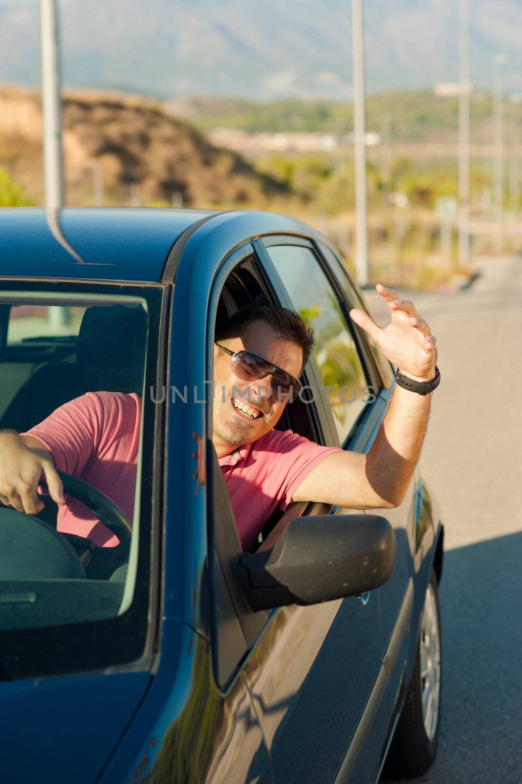 Driver wildly gesticulating out of the window of his car