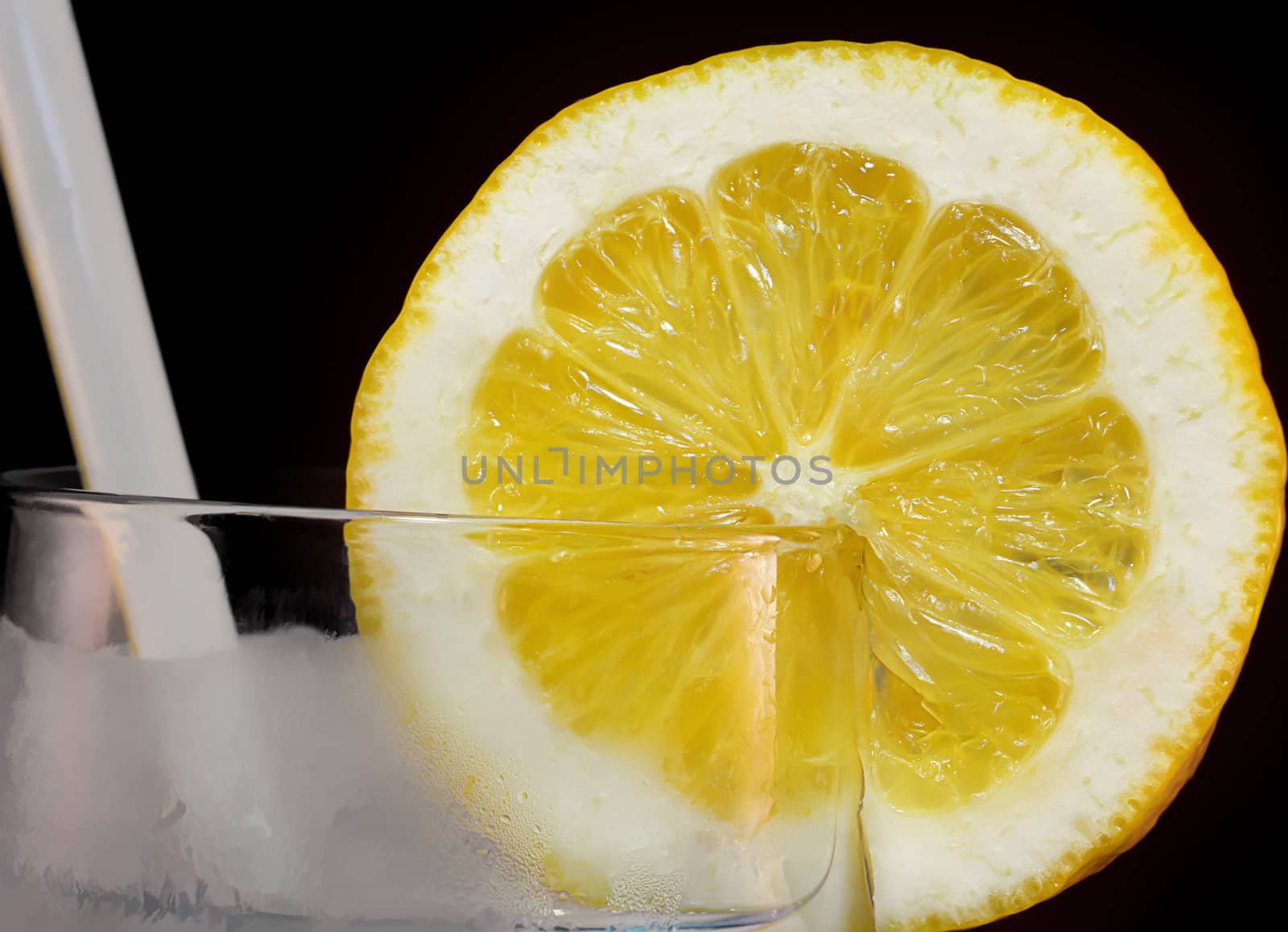 Lemon Slice in an Ice Filled Glass of Water