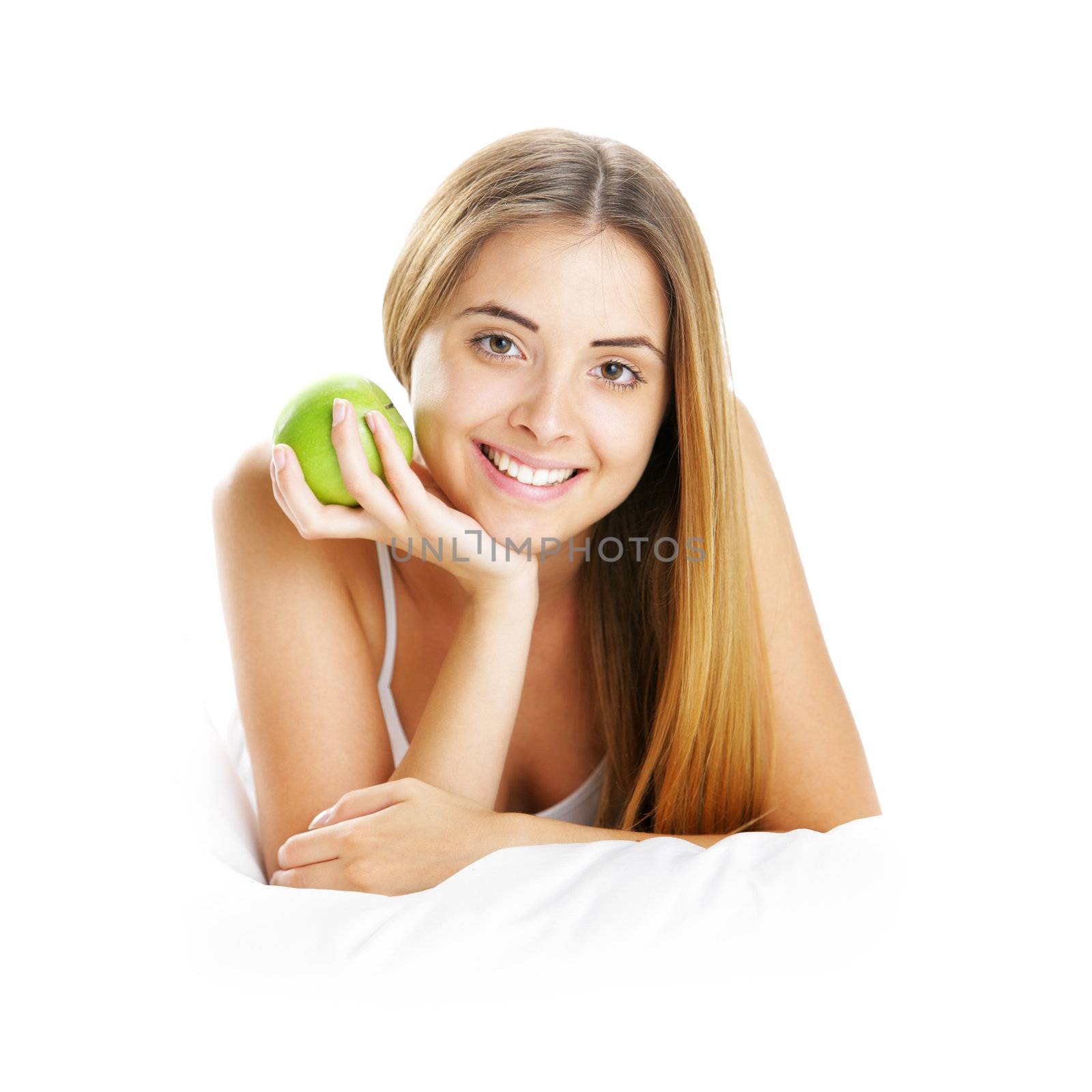 Smiling Young Woman Holding Apple in Bed