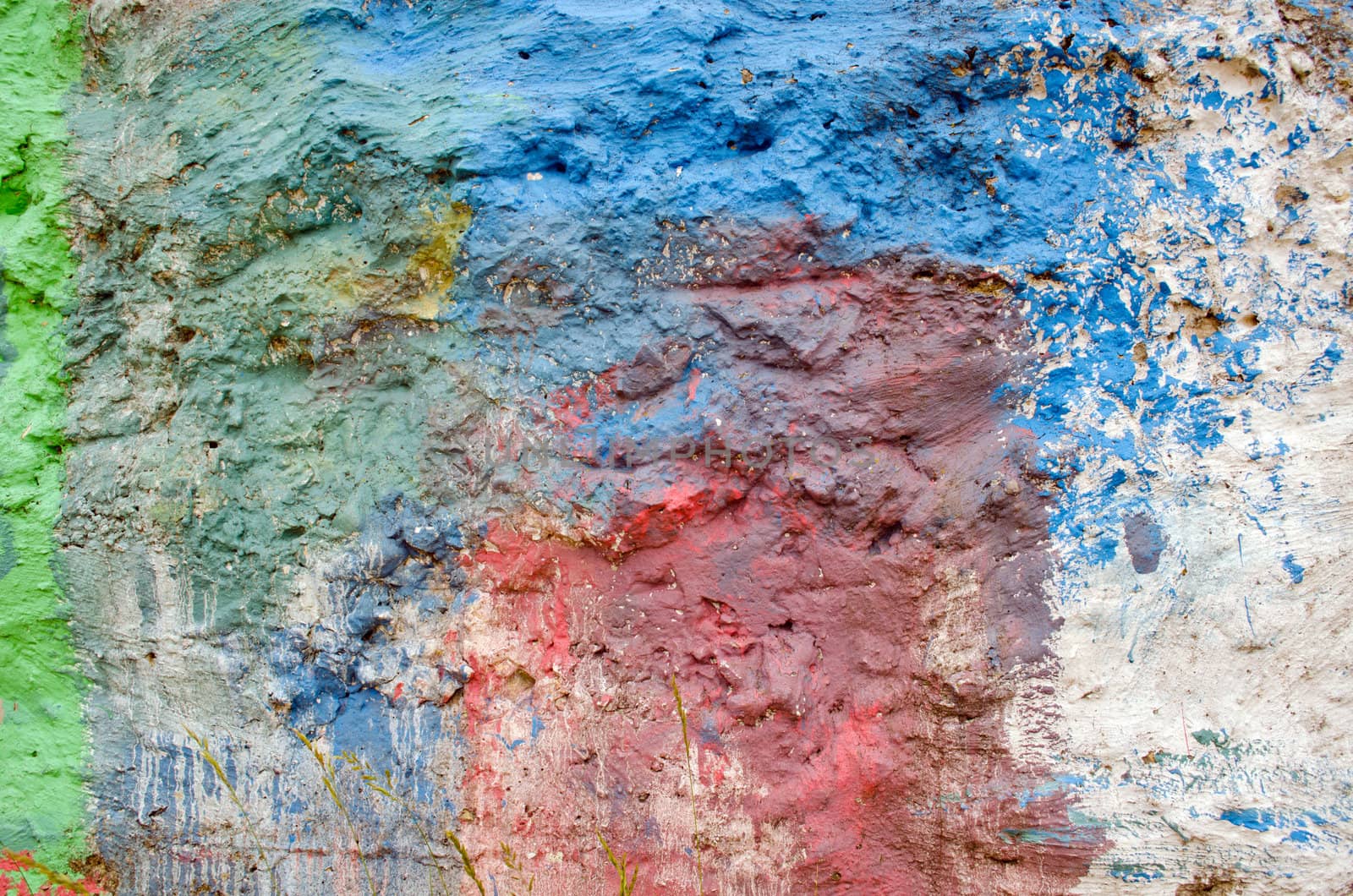 Background of wall painted various colors. Rough surface backdrop.