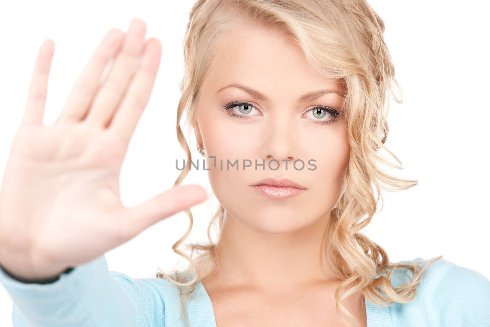 bright picture of young woman making stop gesture