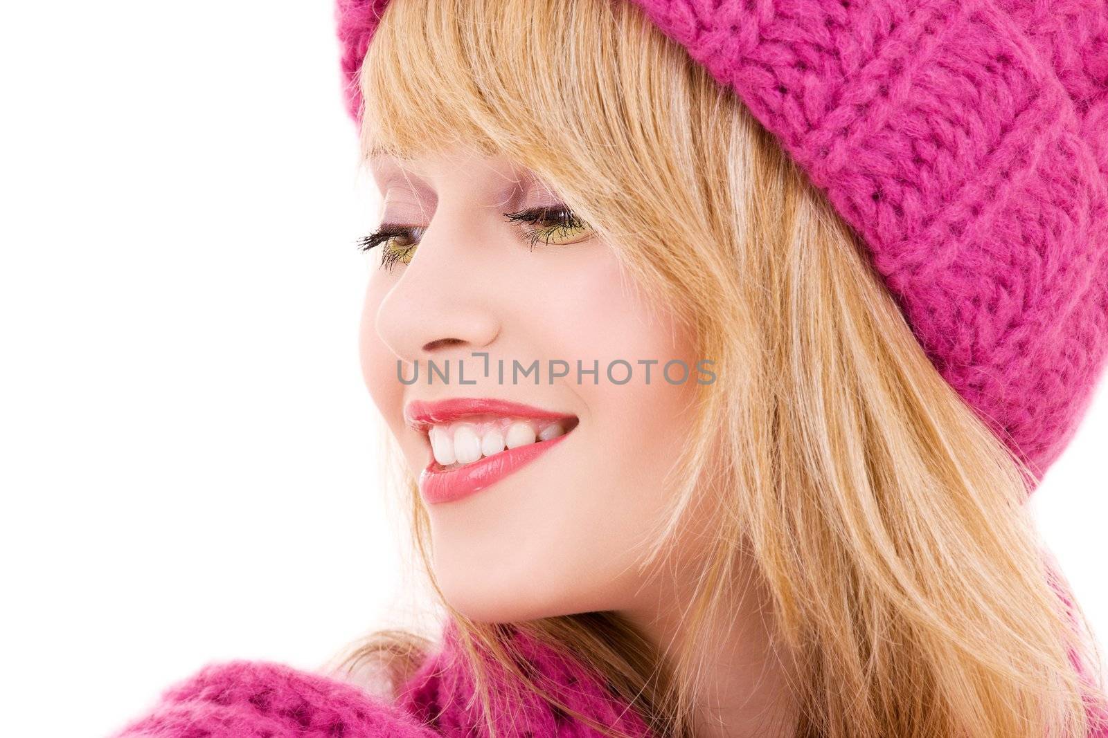 happy teenage girl in winter hat over white