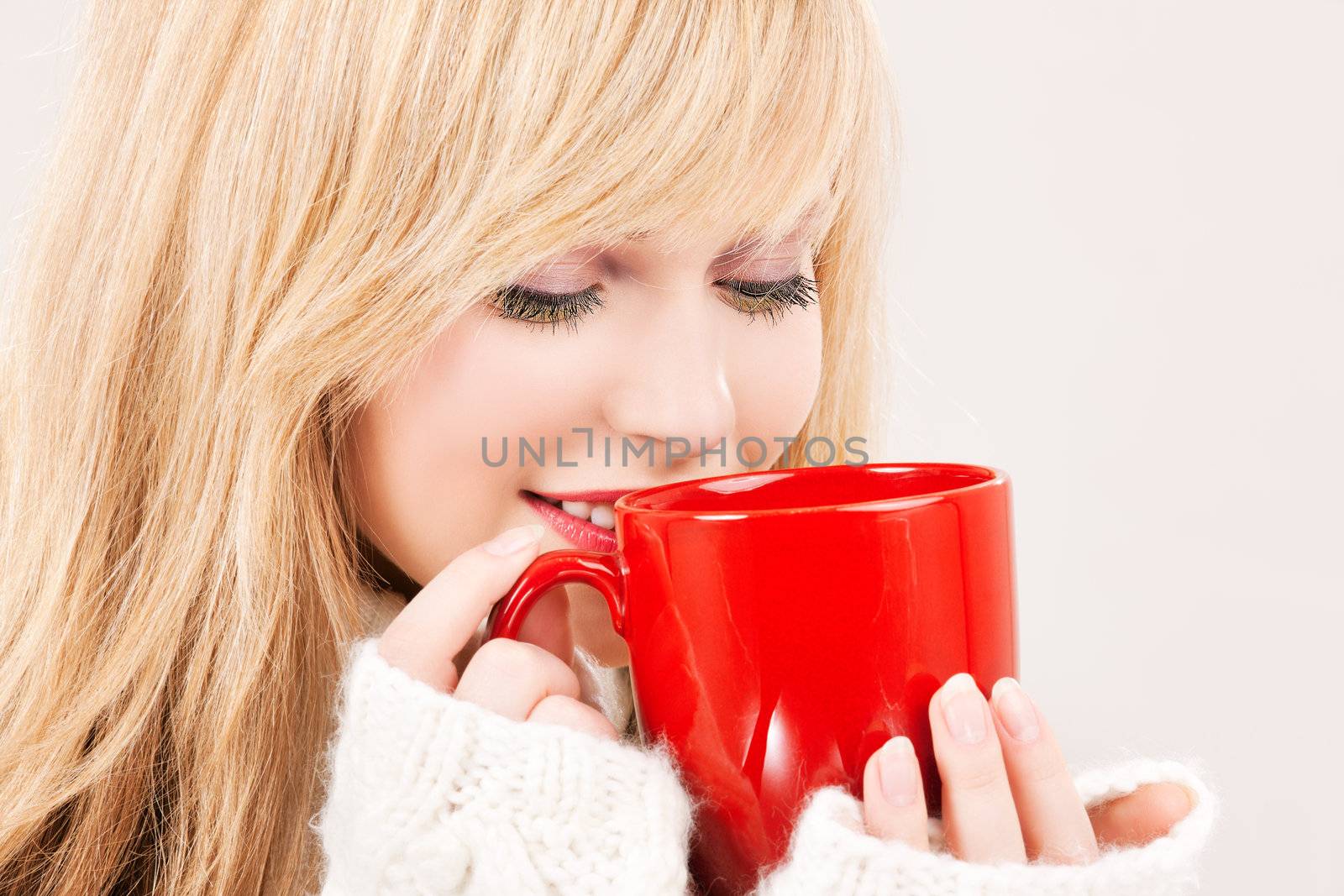 happy teenage girl with red mug by dolgachov