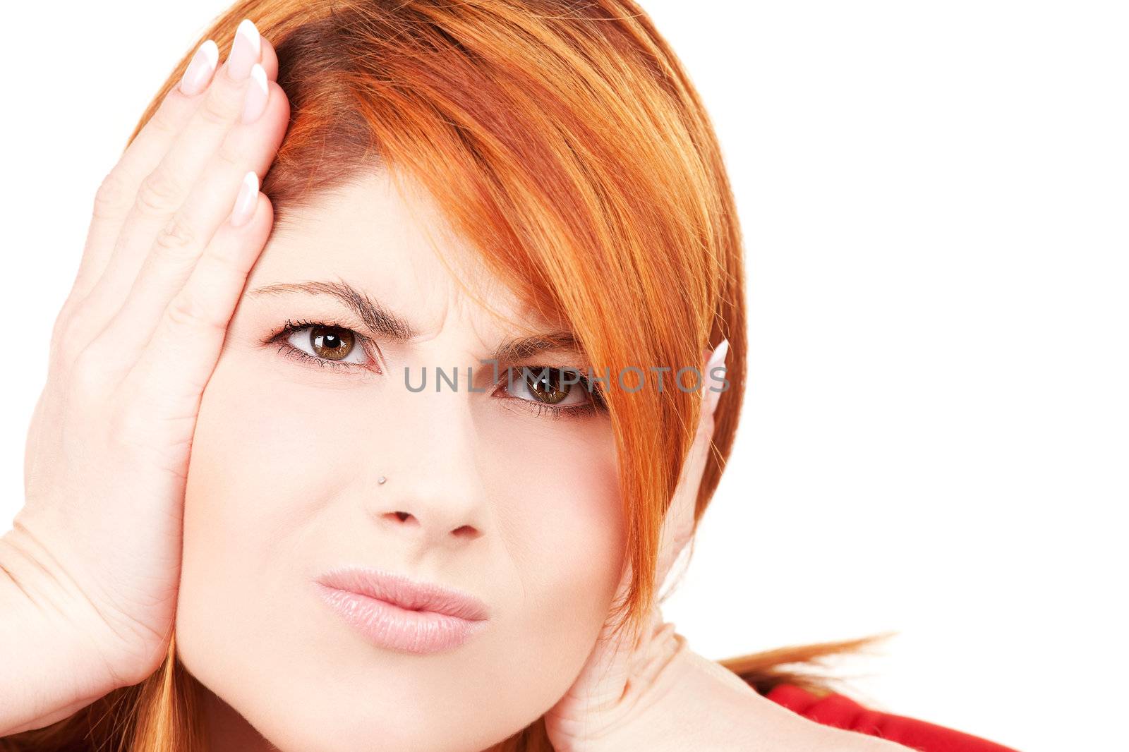 picture of unhappy redhead woman with hands on ears