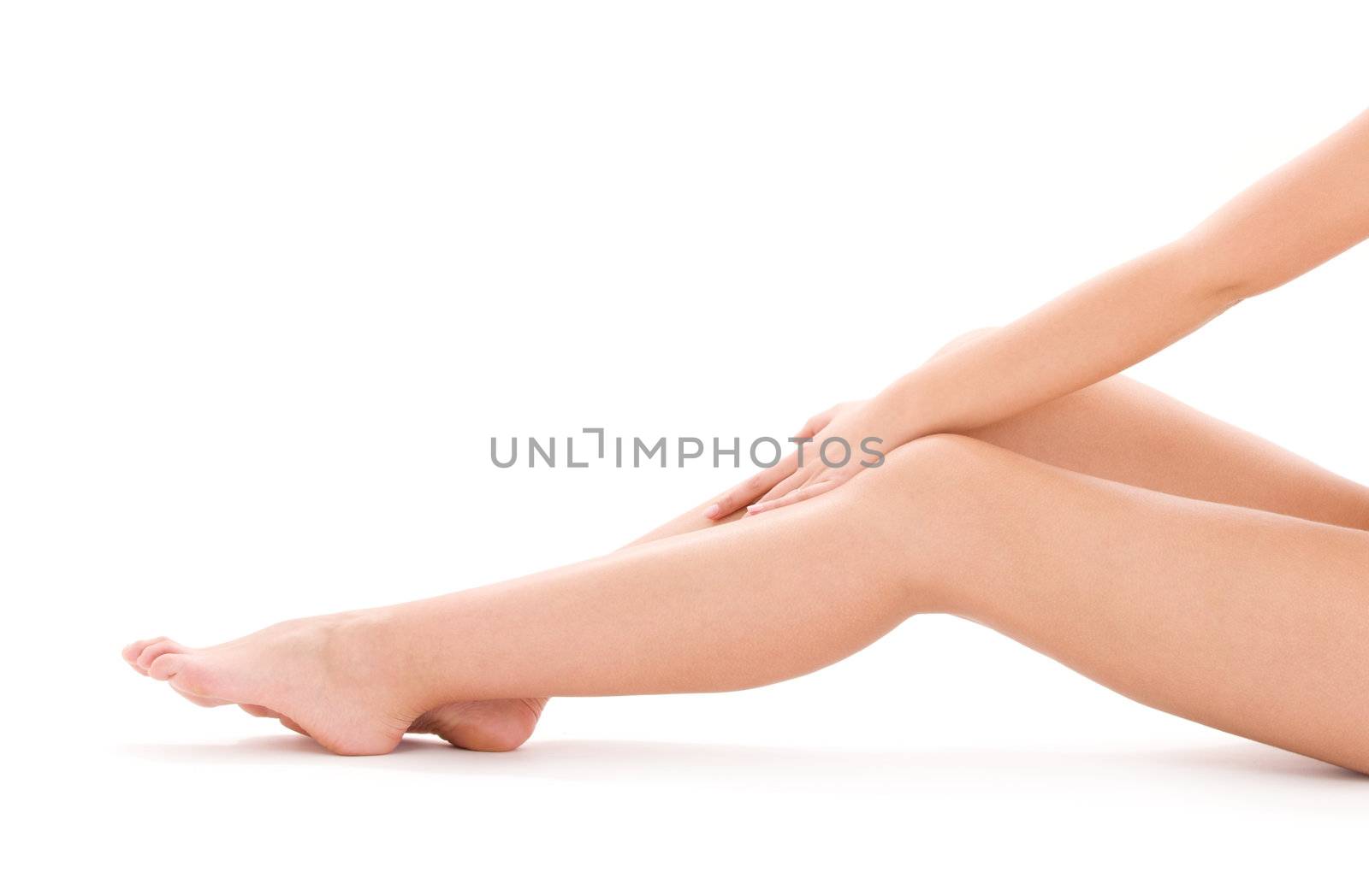 picture of healthy naked woman legs over white