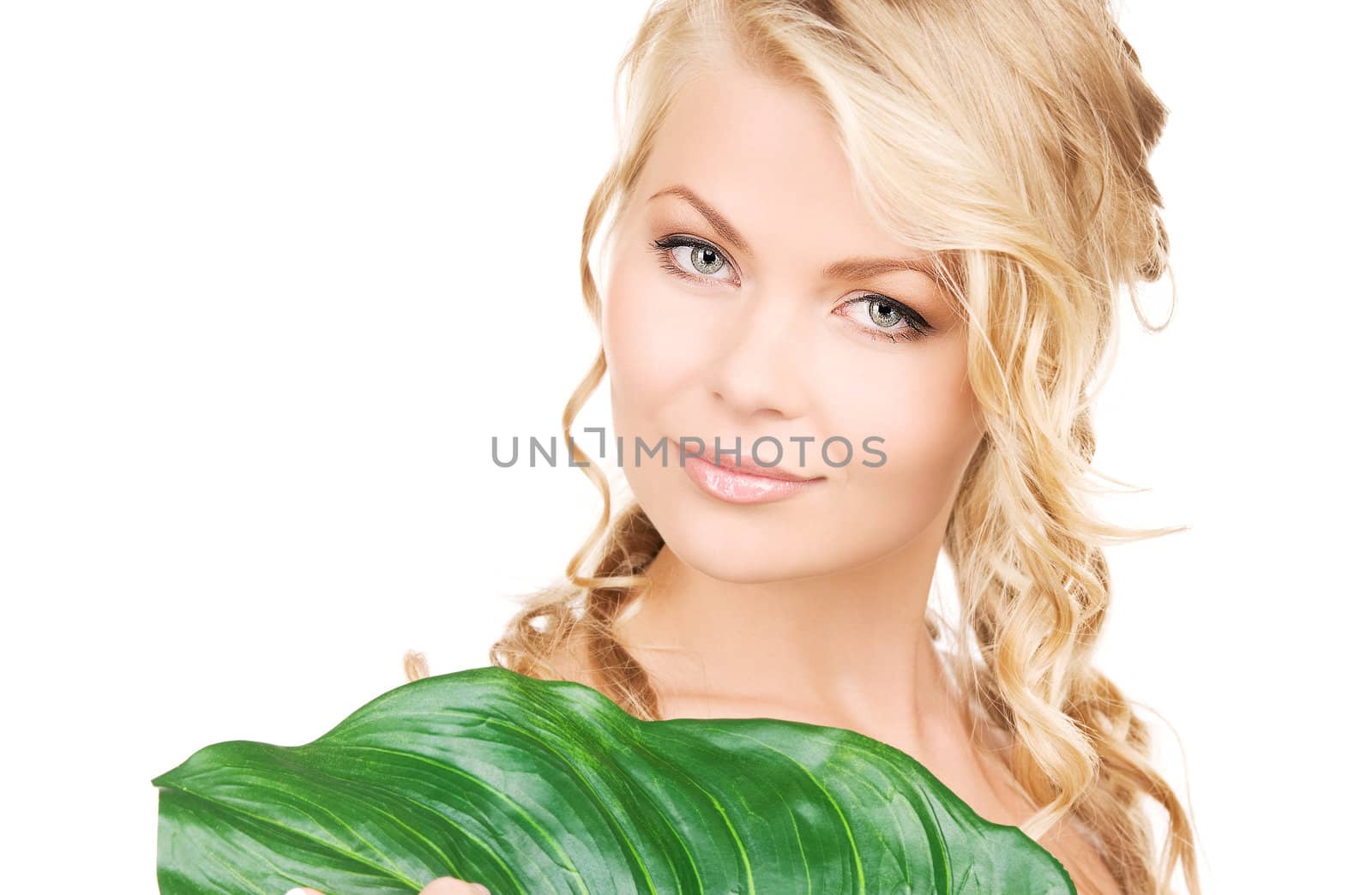 picture of woman with green leaf over white