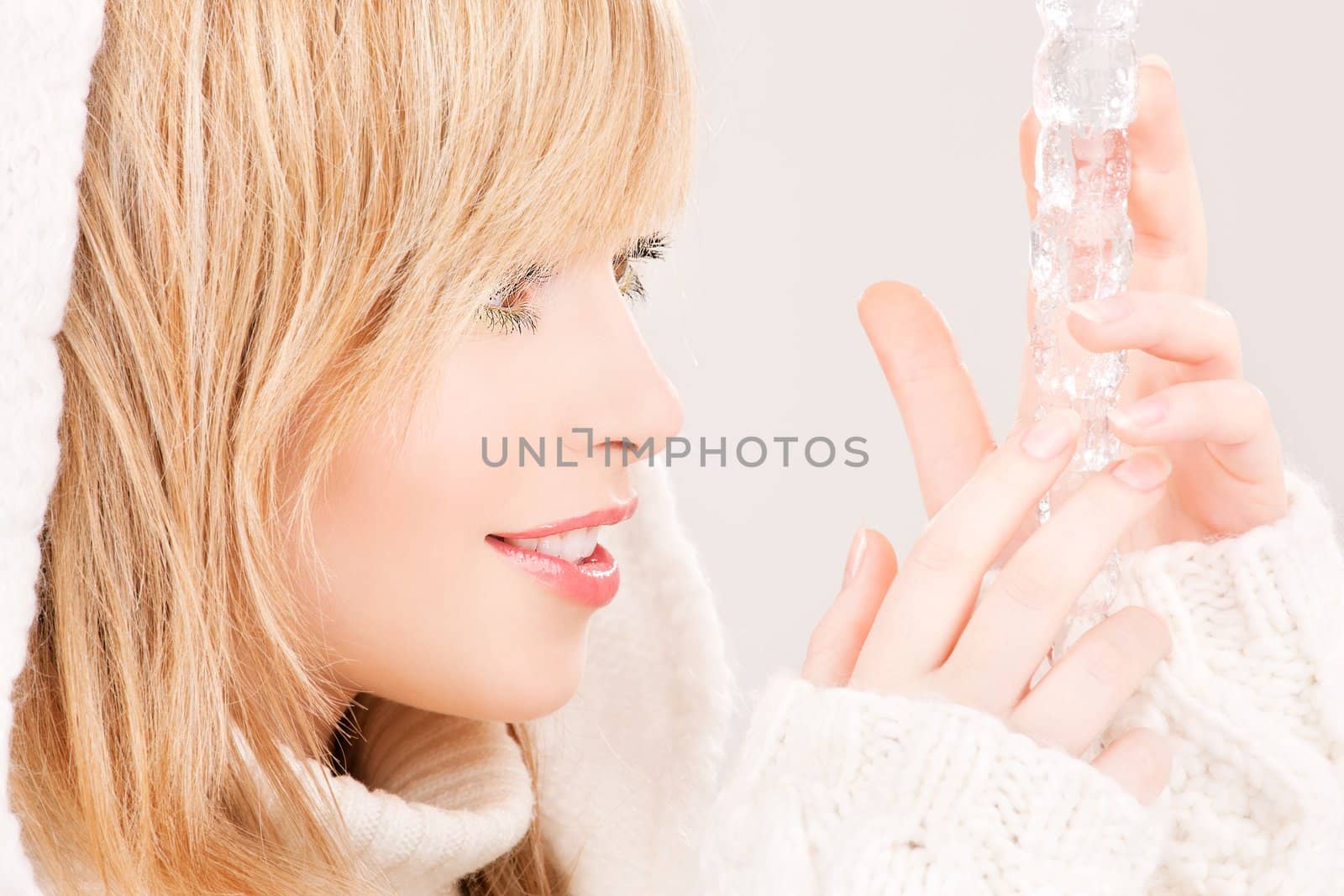 portrait of lovely teenage girl with icicle