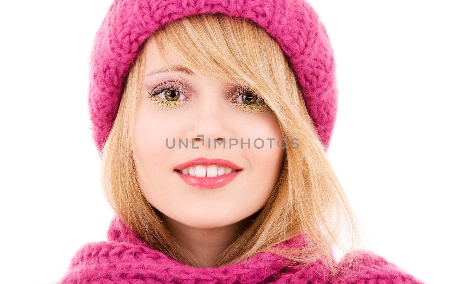 happy teenage girl in winter hat over white