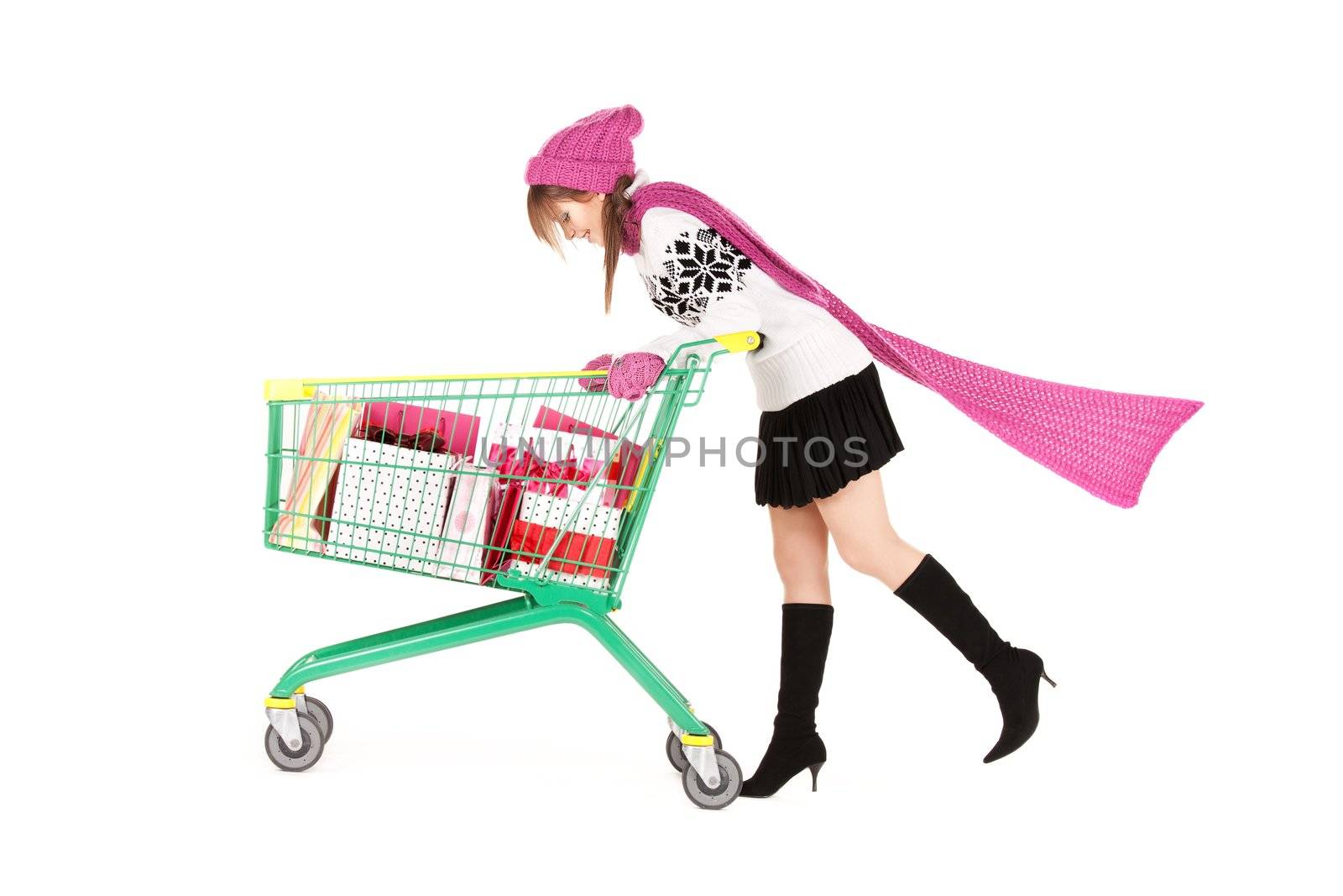 happy teenage girl with shopping cart over white