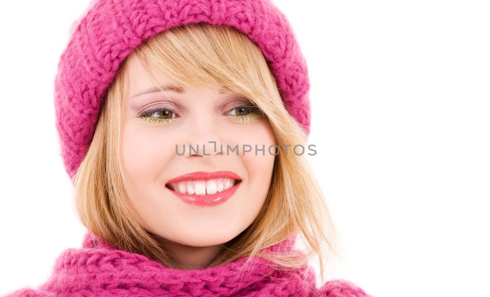 happy teenage girl in winter hat over white