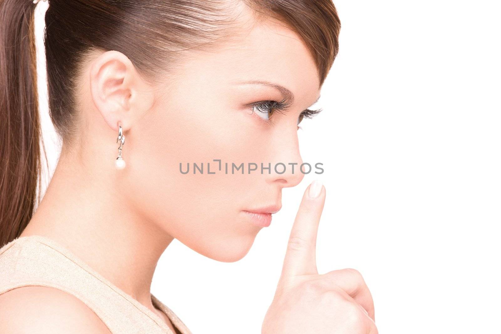 bright picture of young woman with finger on lips