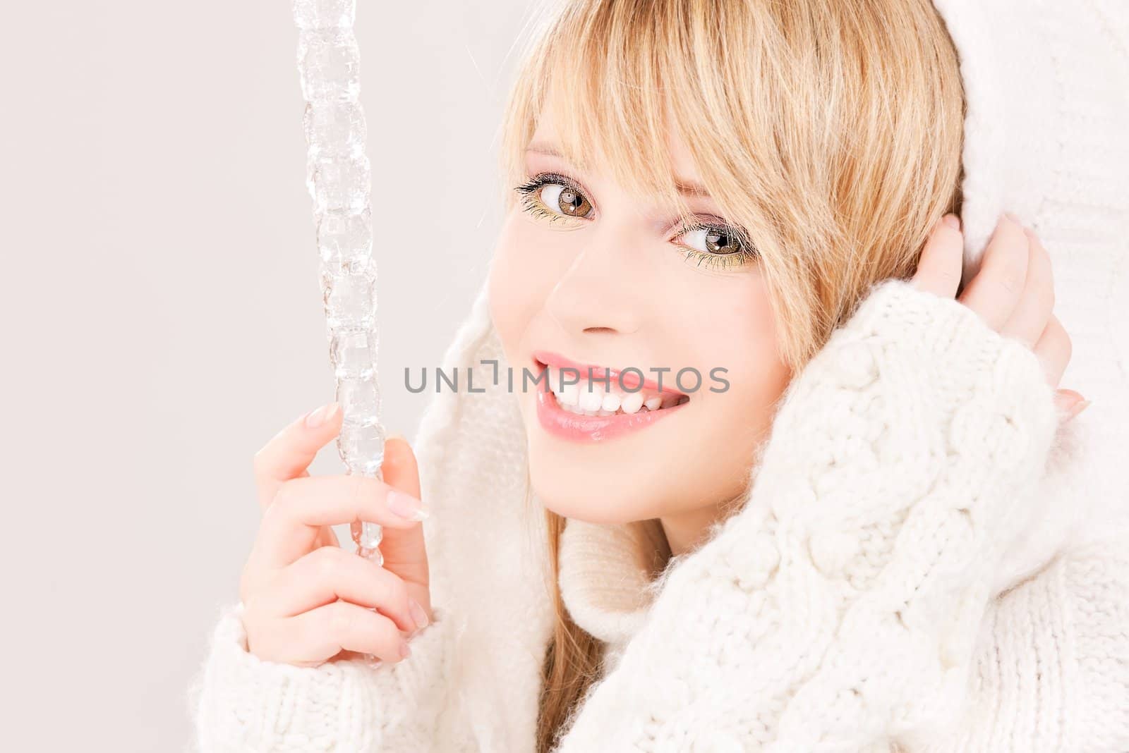 portrait of lovely teenage girl with icicle