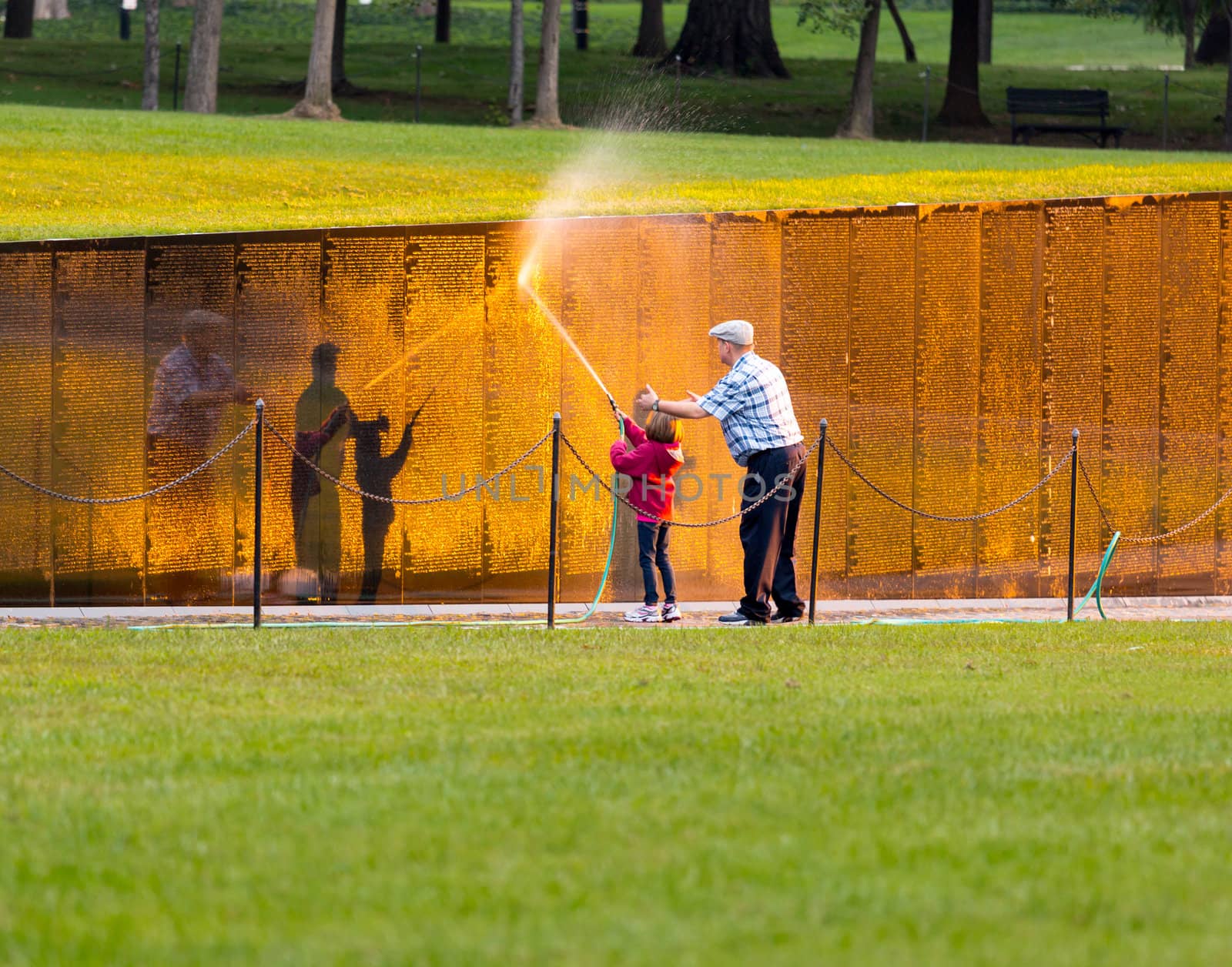 WASHINGTON DC - SEPTEMBER 16: Volunteers clean Vietnam Memorial wall on September 16, 2012. The Wall was completed by Maya Lin in 1982.