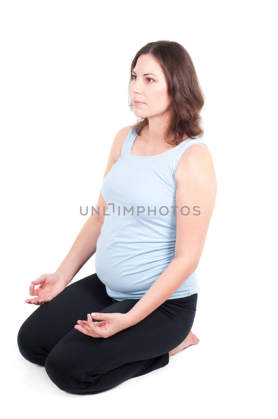 Portrait of pretty pregnant woman practicing yoga by anytka