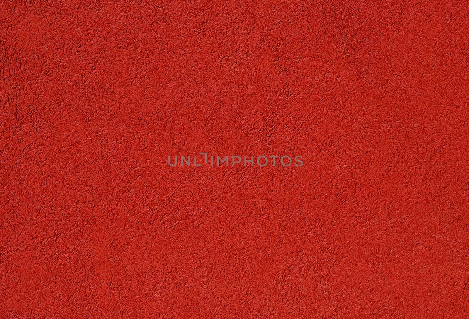 Red painted plastered house wall as background