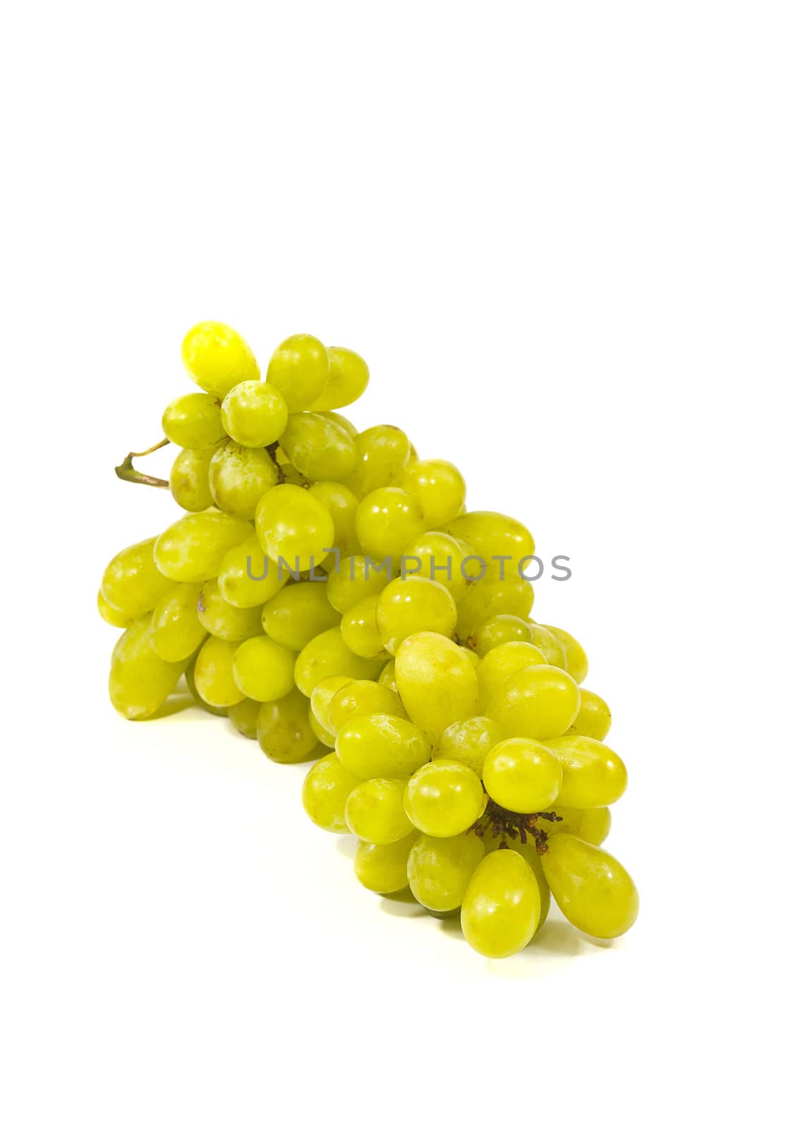 Bunch of ripe and juicy green grapes close-up on a white background