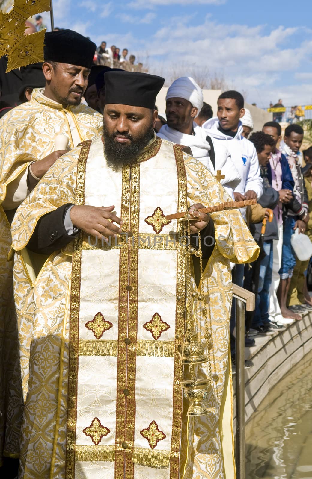 QASER EL YAHUD , ISRAEL - JAN 19 : Ethiopian Orthodox priests participates in the annual baptising ceremony during the epiphany at Qaser el yahud , Israel in January 19 2012