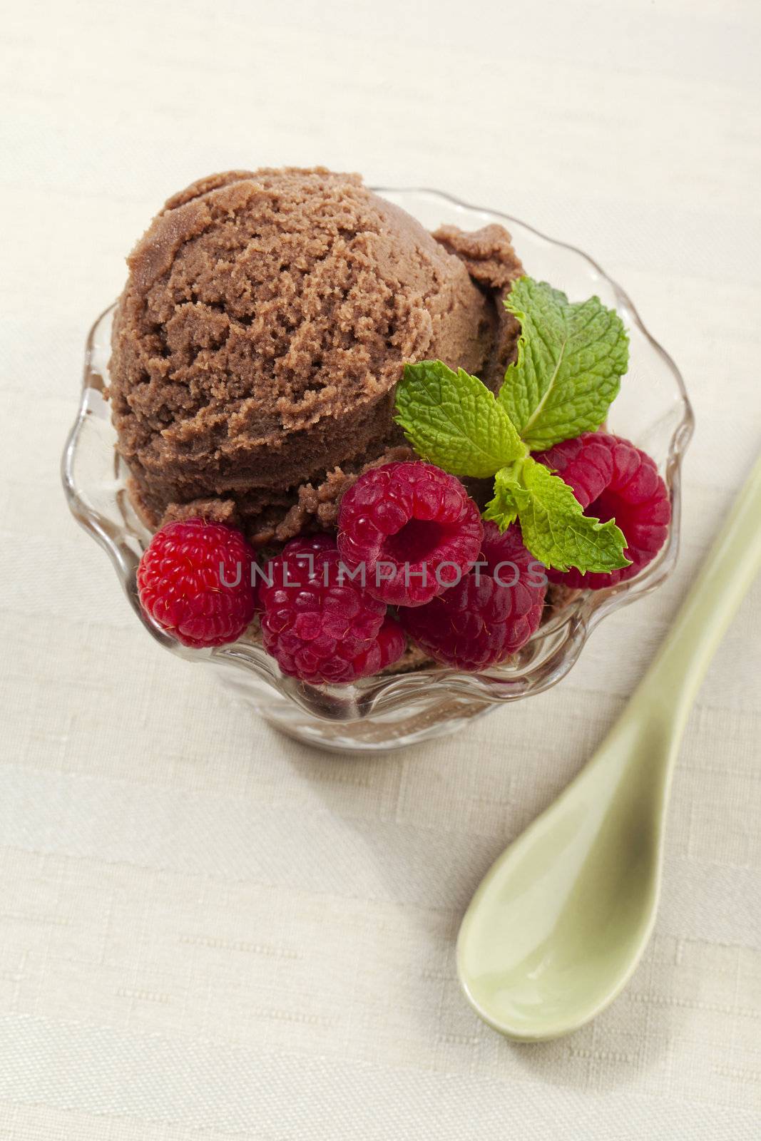 cup of ice cream with raspberries by kozzi