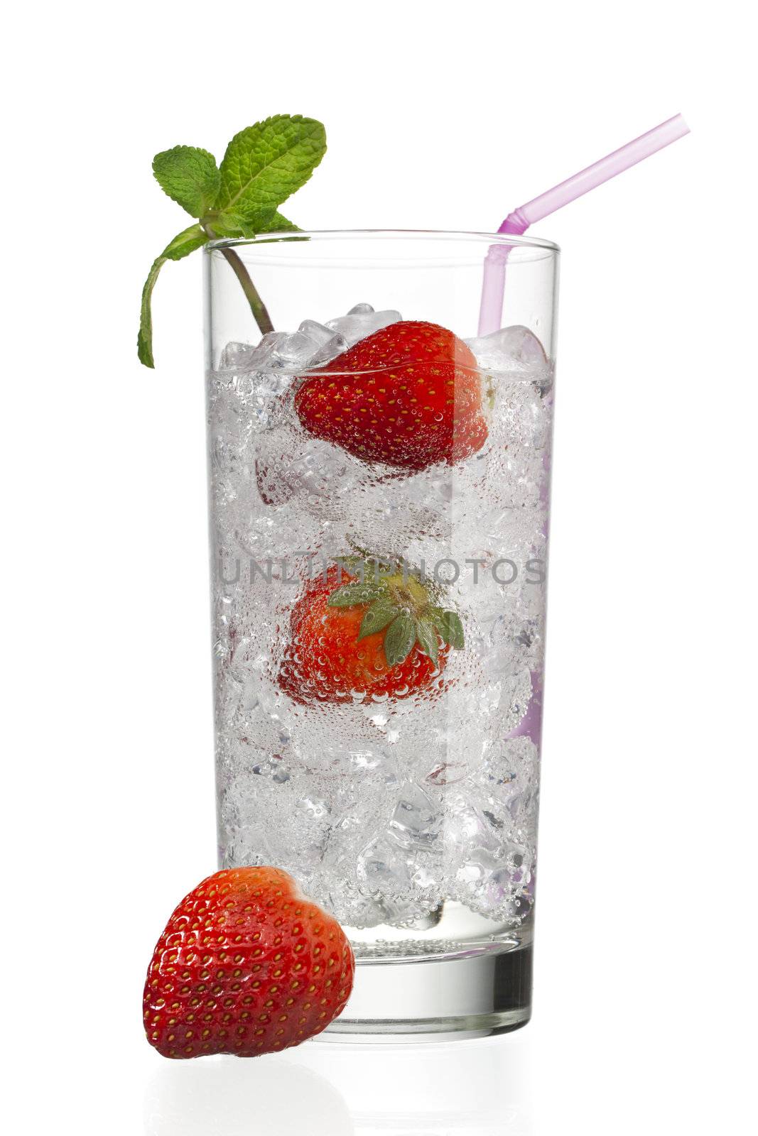 glass with ice cubes and strawberries by kozzi