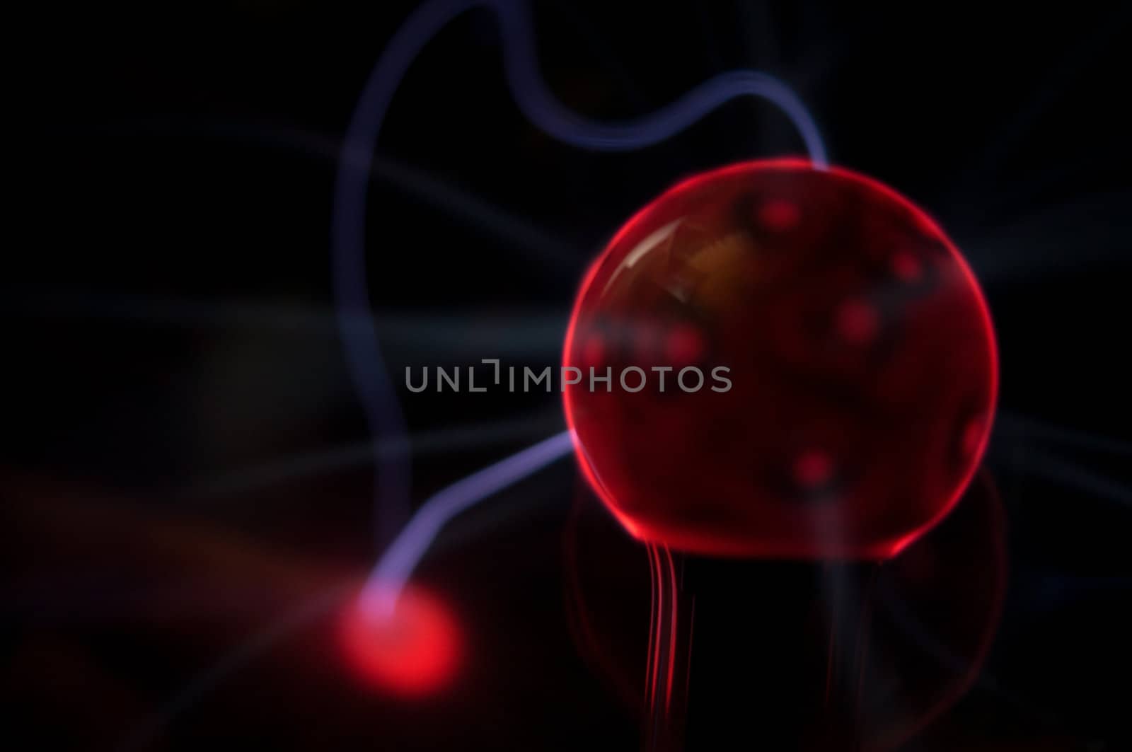 Electric red and blue retro plasma light ball with red and blue surges of light