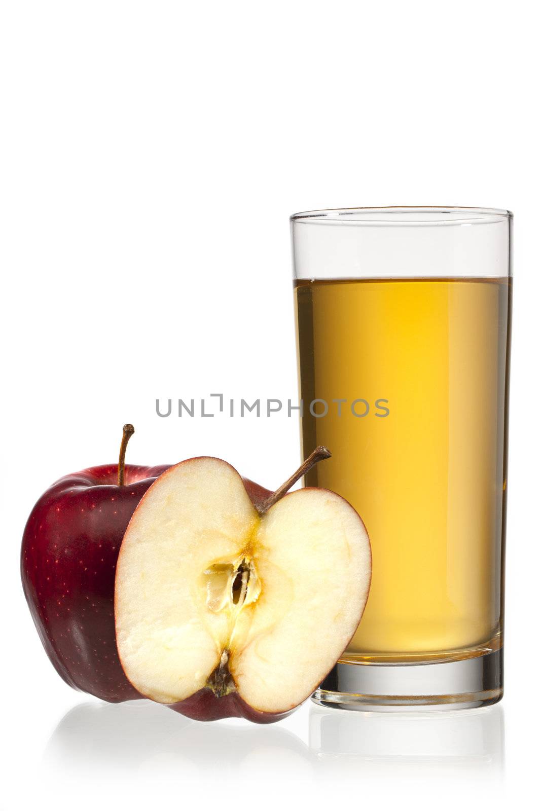 Apple juice with crisp looking apple in foreground and isolated on white