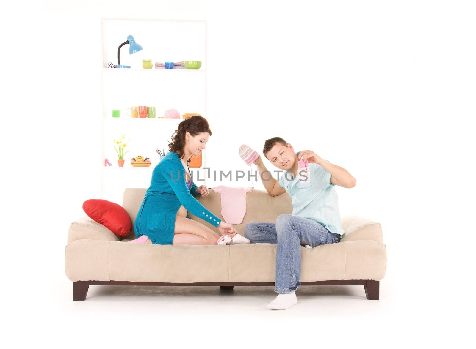 picture of happy couple with childrens clothing