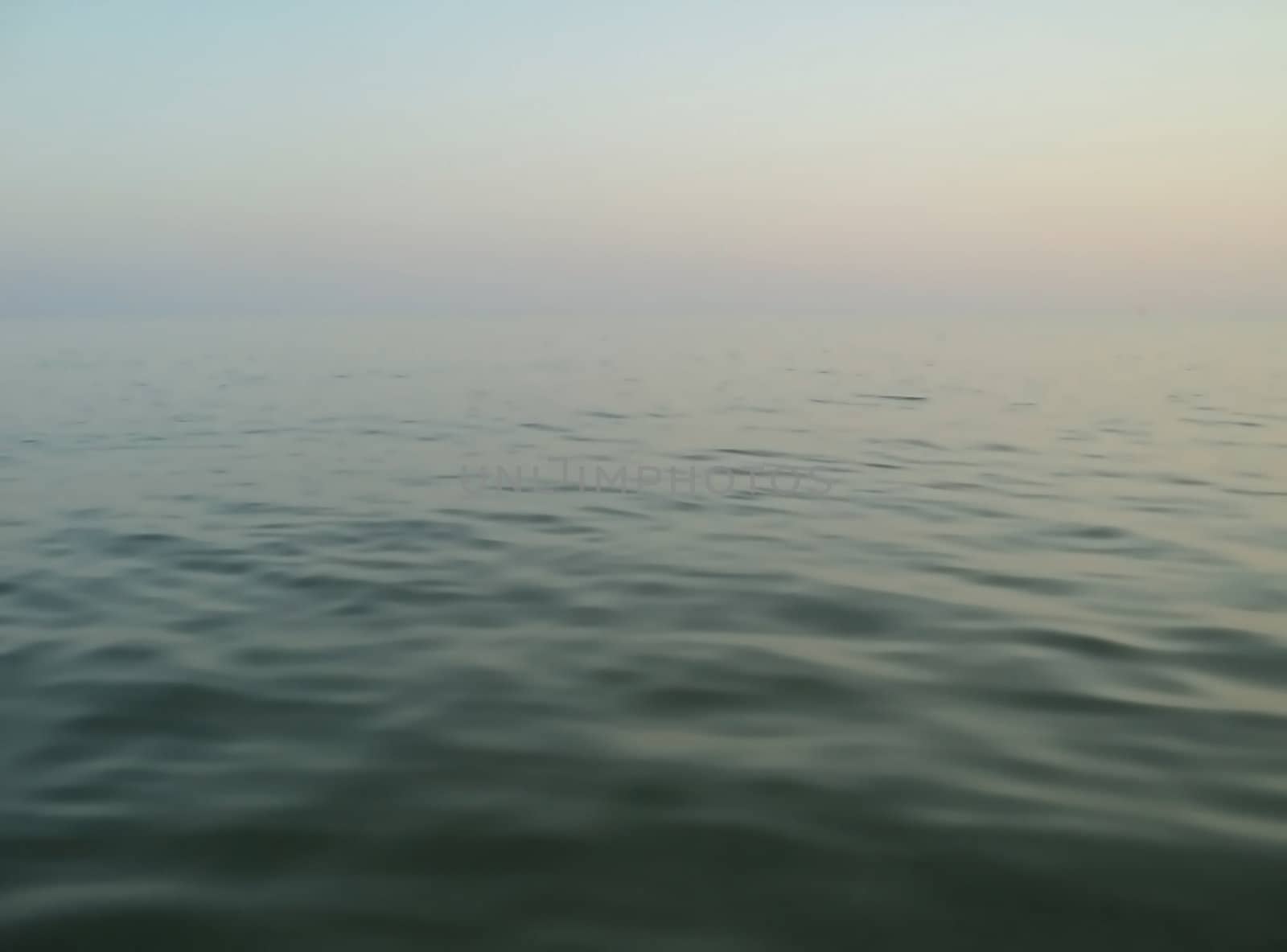                  Sea landscape: overview calm sea with a blurred horizon              