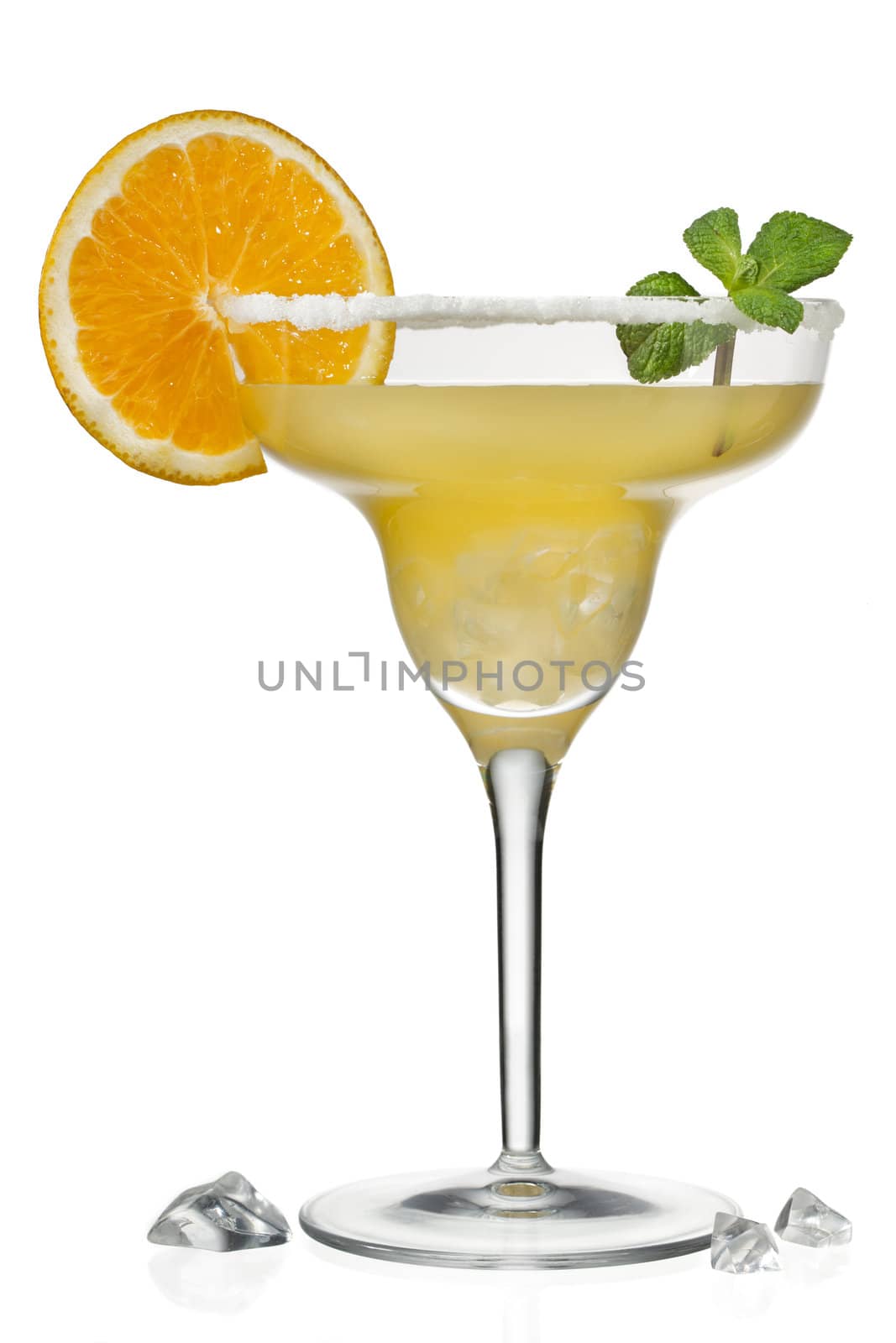 orange juice in martini glass with slice of a orange and mint leaf